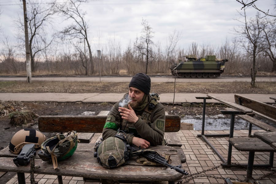 A Ukrainian serviceman smokes a cigarette after leaving Bakhmut, in Chasiv Yar, Ukraine, Friday, March 3, 2023.