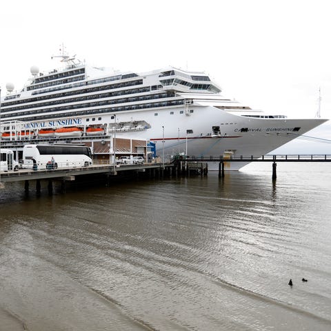 Passengers disembark from the Carnival Sunshine cr