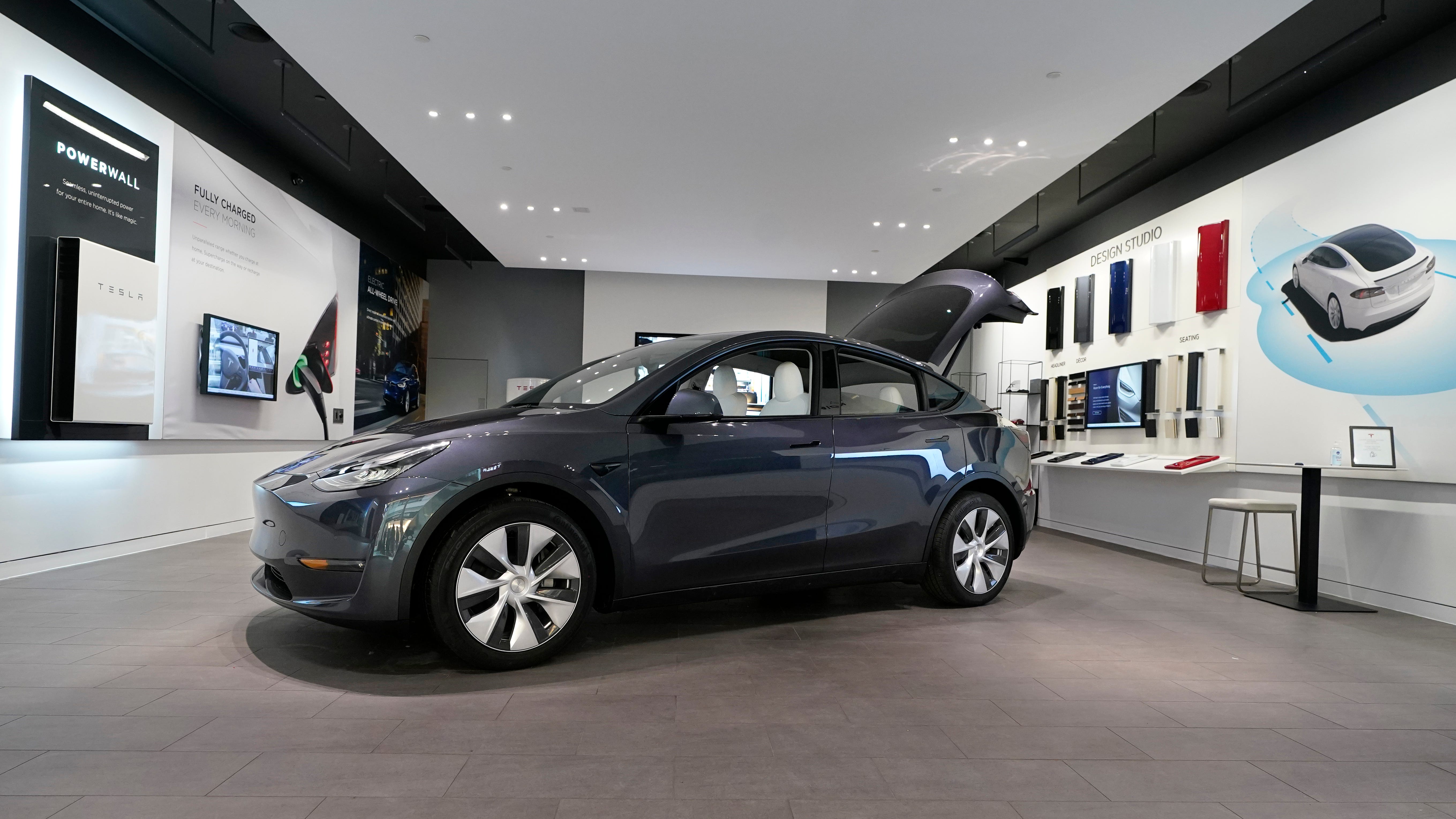 FILE - A Tesla Model Y Long Range is displayed on Feb. 24, 2021, at the Tesla Gallery in Troy, Mich. U.S. auto safety regulators have opened an investigation into Tesla's Model Y SUV after getting two complaints that the steering wheels can come off while being driven. The National Highway Traffic Safety Administration says the probe covers an estimated 120,000 vehicles from the 2023 model year.  (AP Photo/Carlos Osorio, File) ORG XMIT: ALP101