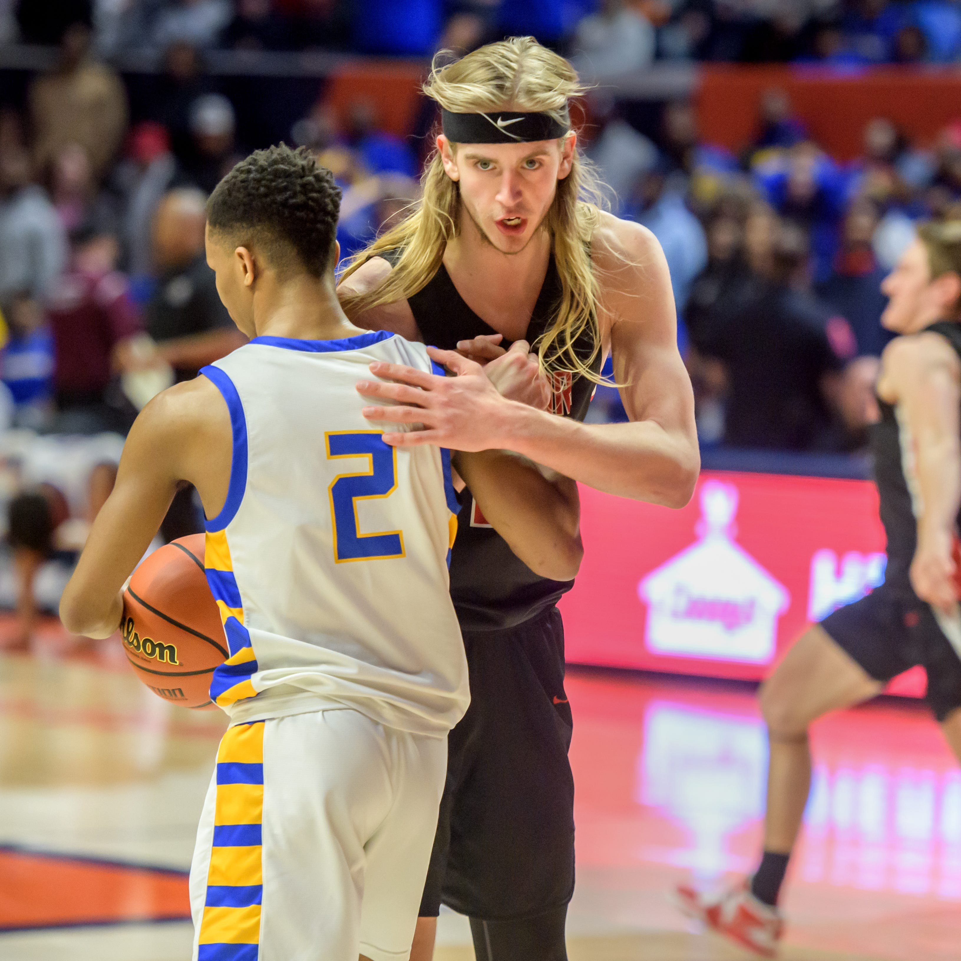 Metamora's Ethan Kizer consoles Chicago Simeon's Jalen Griffith as time runs out on the Redbirds' 46-42 victory in the Class 3A basketball state title game Saturday, March 11, 2023 at State Farm Center in Champaign.