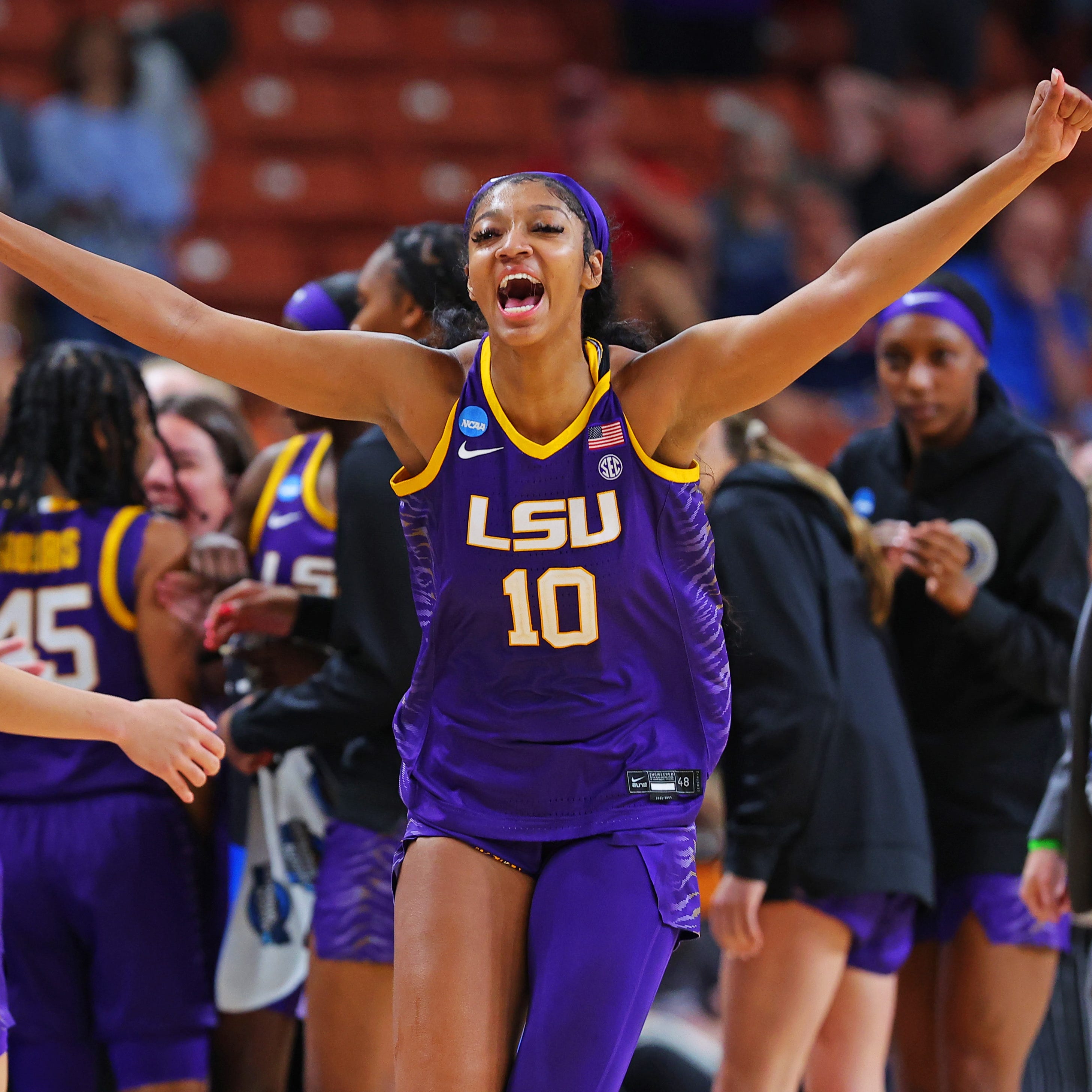 Angel Reese celebrates after LSU defeated Utah in the Sweet 16.