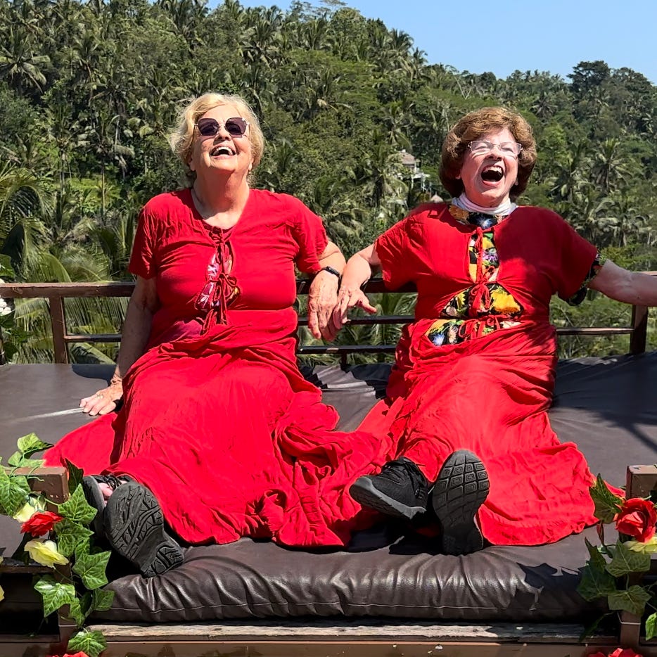 Best friends Ellie Hamby and Sandy Hazelip enjoy a swing and a laugh in Bali, Indonesia on March 16, 2023.