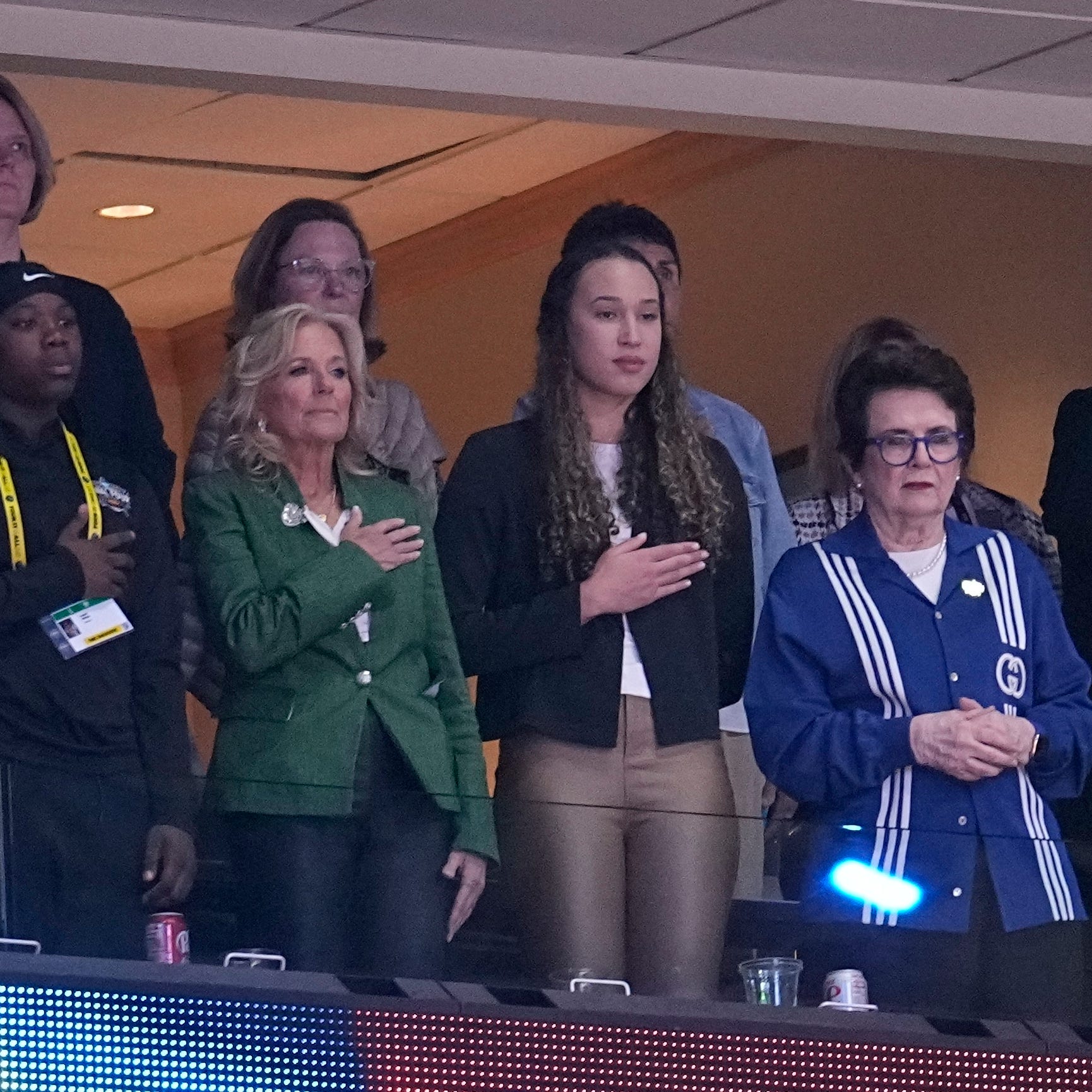 First Lady Jill Biden and others listen to the national anthem before the NCAA Women's Final Four championship basketball game between LSU and Iowa Sunday, April 2, 2023, in Dallas. (AP Photo/Tony Gutierrez)