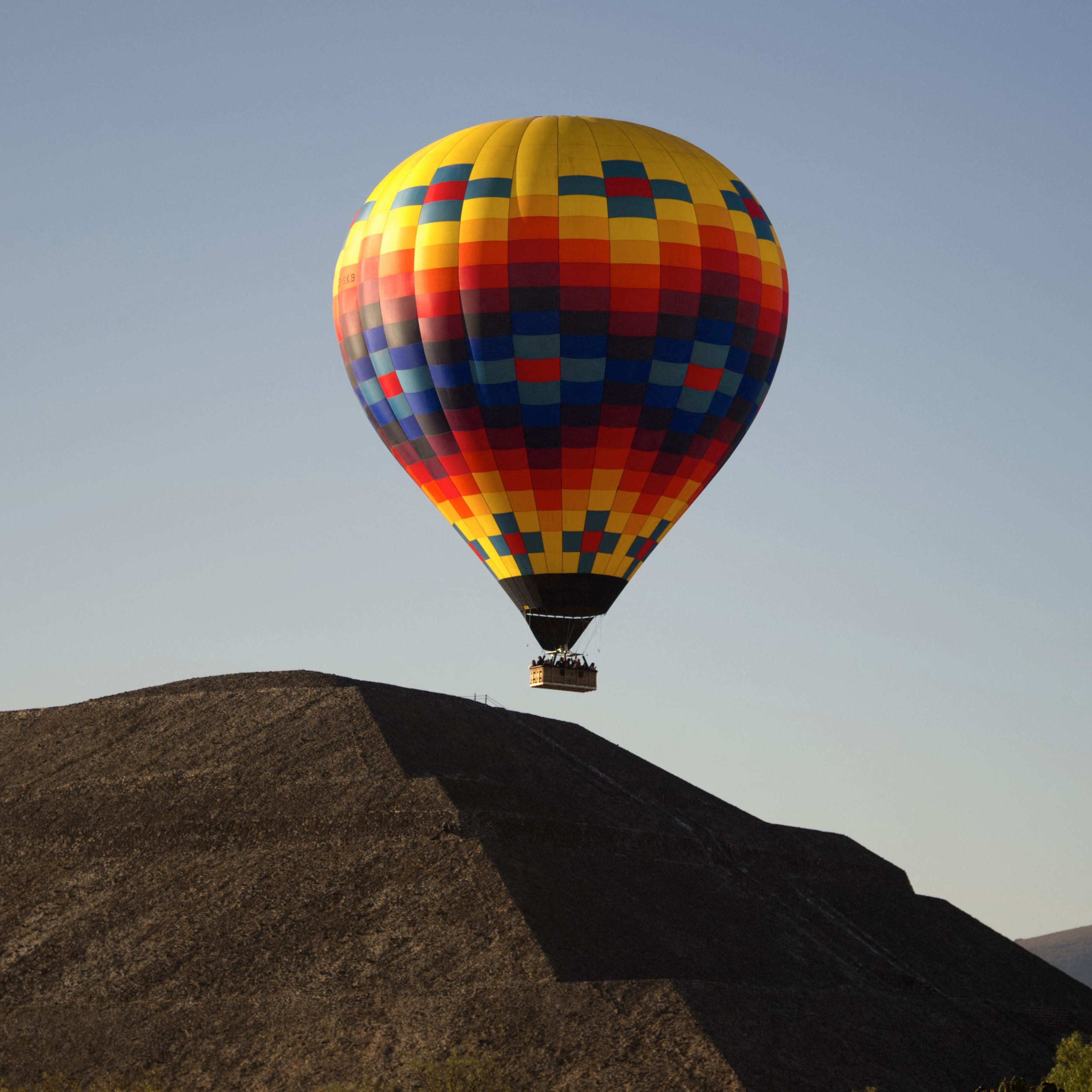 A hot air balloon is seen over the Pyramid of the Moon in Teotihuacan, Mexico State, during the spring equinox celebration on March 20, 2023.