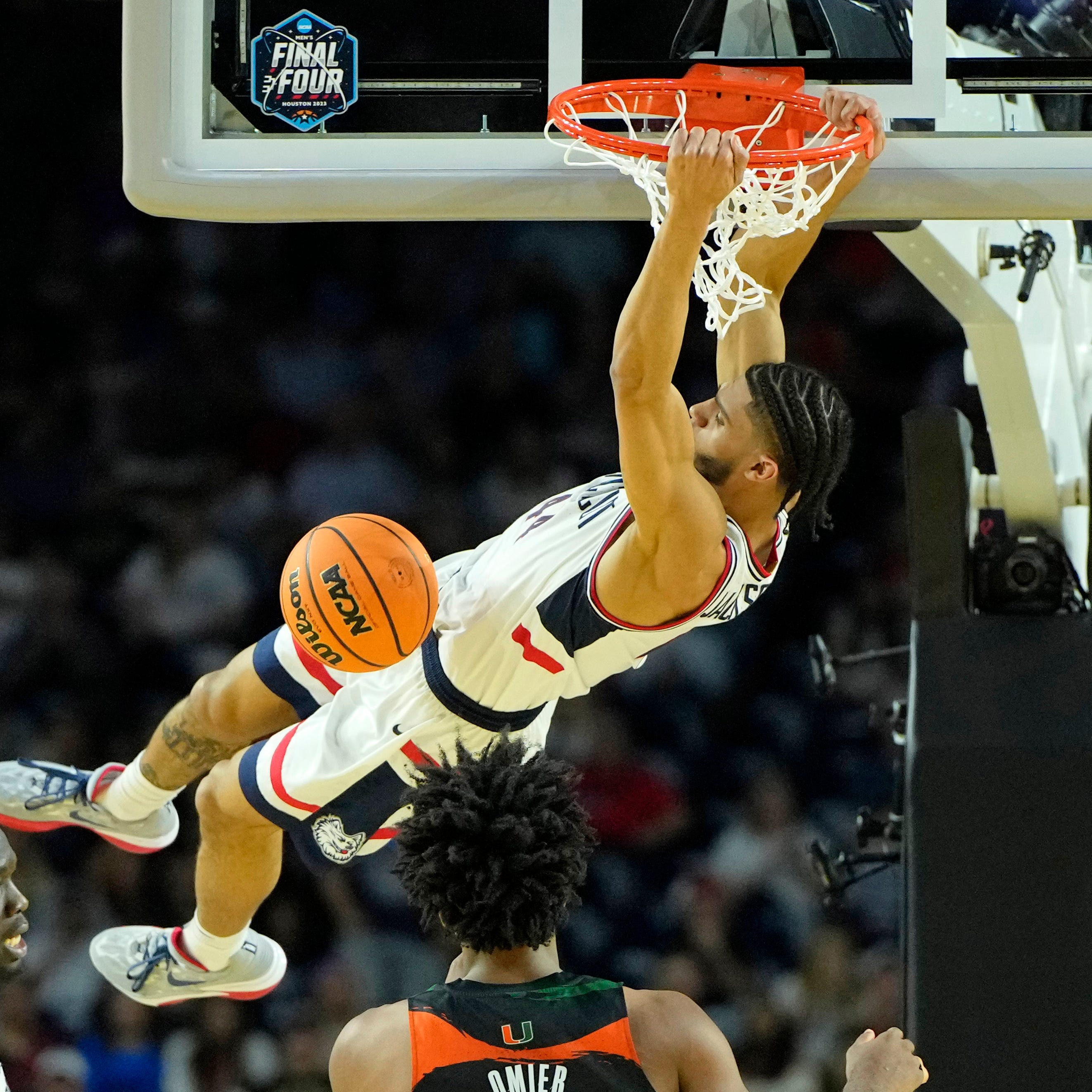 Connecticut guard Andre Jackson Jr. dunks against Miami in the second half of Saturday's Final Four game.