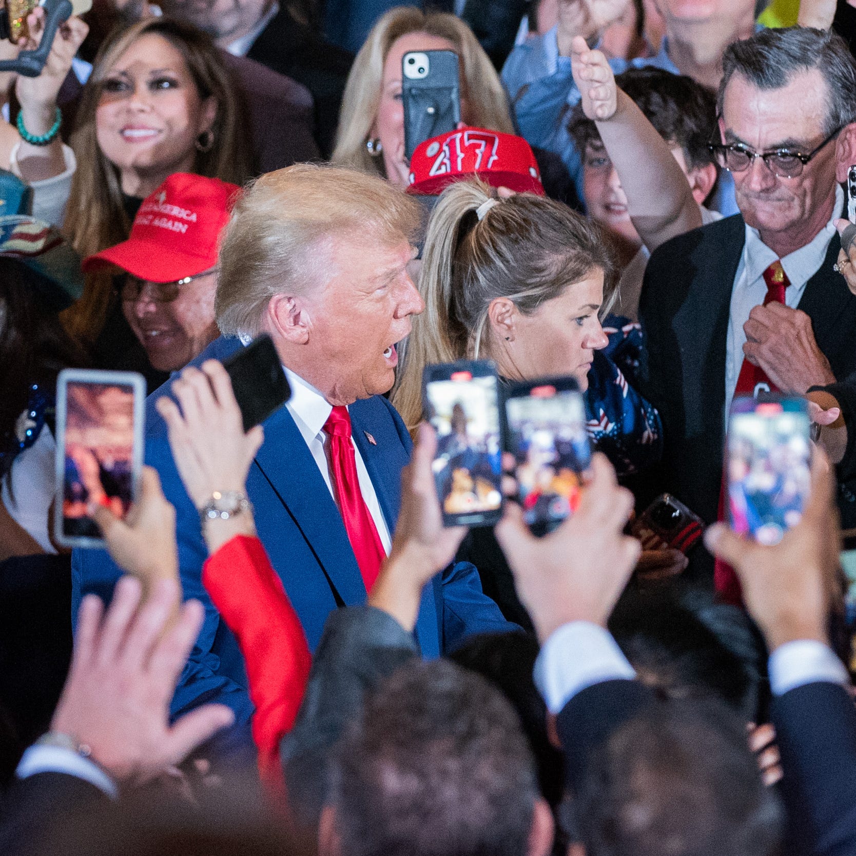 Former President Donald Trump greets supporters as he arrives to a press event at Mar-A-Lago on Tuesday, April 4, 2023, in Palm Beach FL. Former President Trump returned to Mar-A-Lago Tuesday evening after facing arraignment in New York earlier in the day.