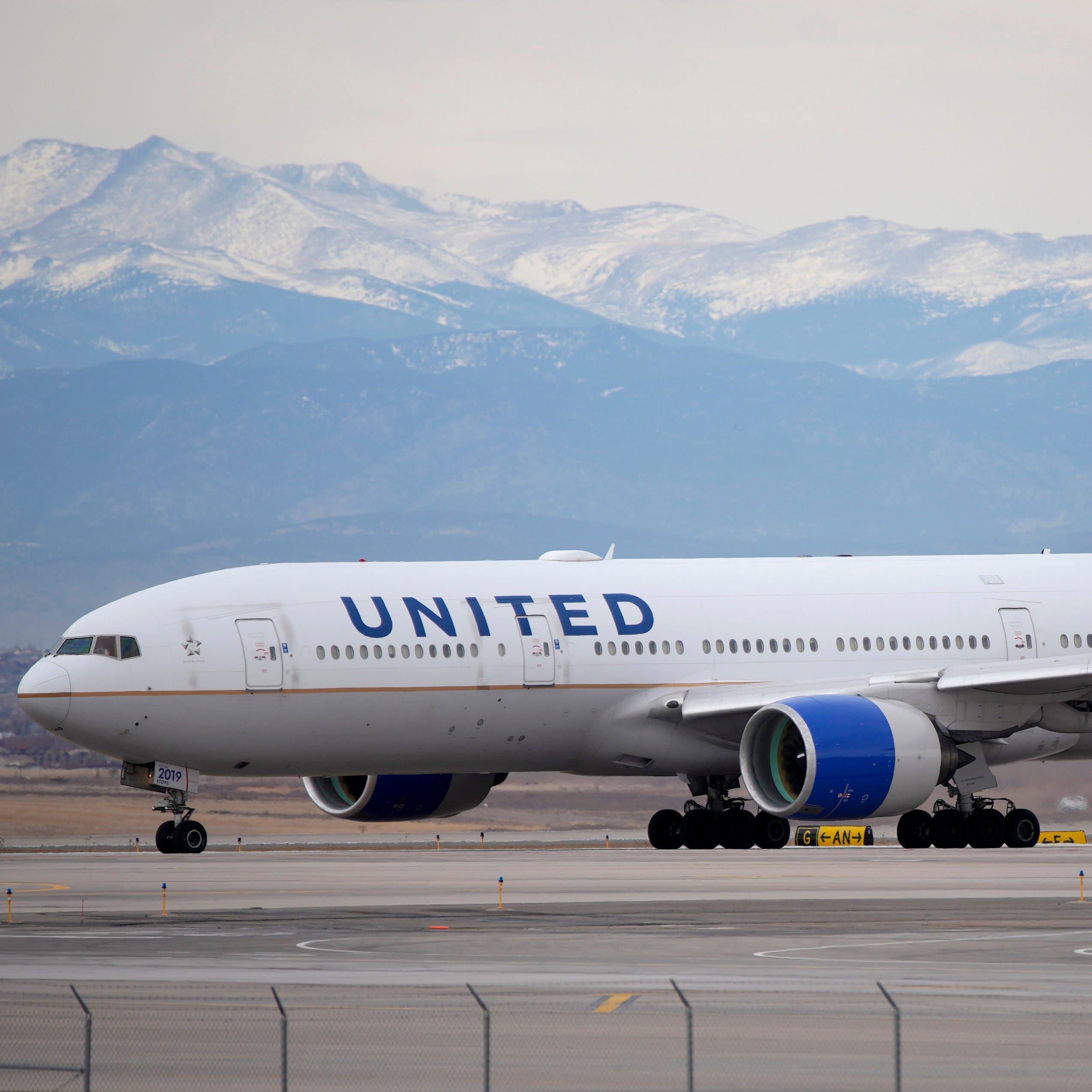 A United Airlines jetliner taxis to a runway for take off from Denver International Airport, Dec. 27, 2022.