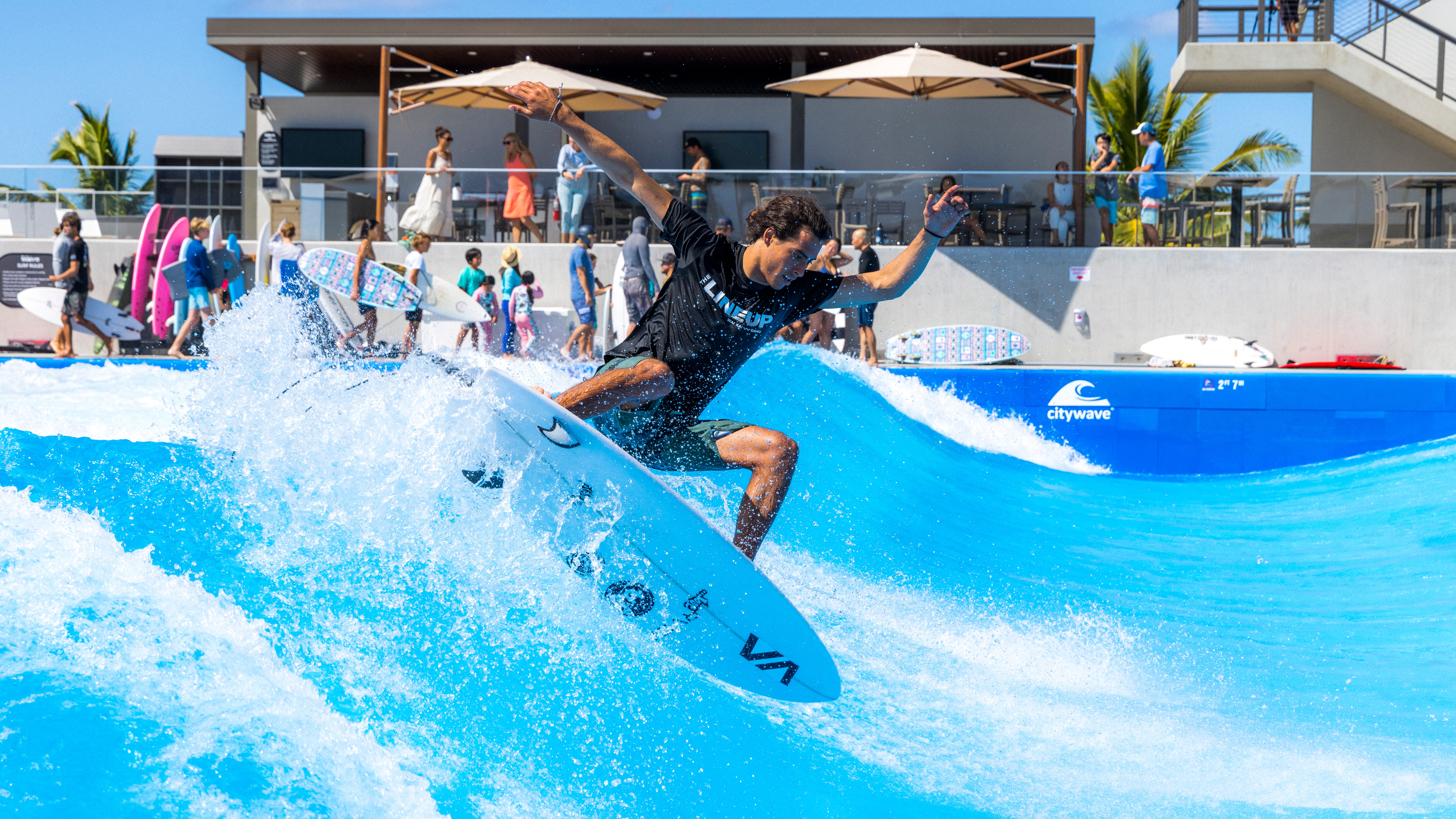 A surfer rips on the wave pool, which is basically limited to exclusively shortboards.