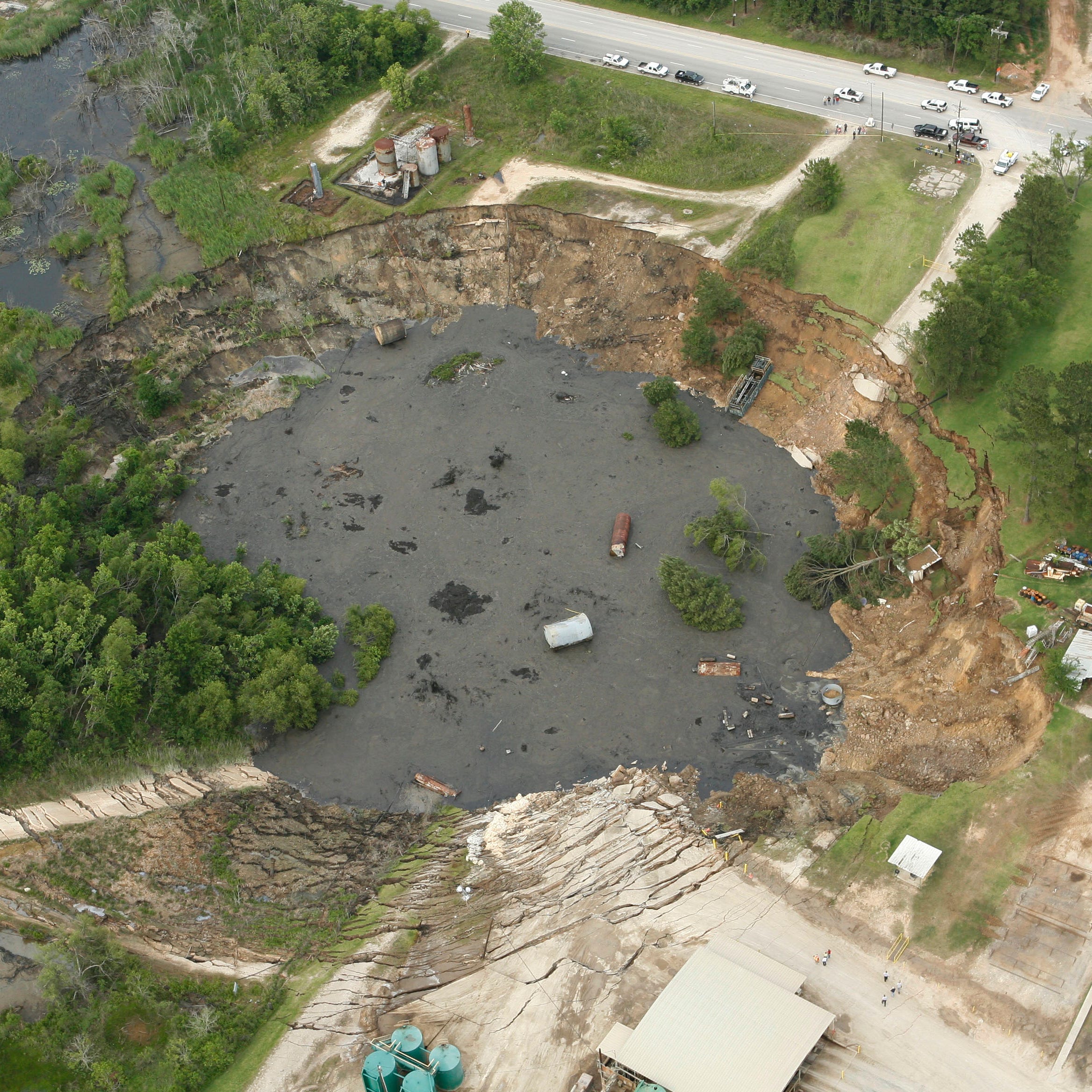 A massive sinkhole near Daisetta, Texas, is seen Wednesday afternoon, May 7, 2008.  A large sinkhole swallowed up oil field equipment and some vehicles Wednesday in southeastern Texas and continued to grow.