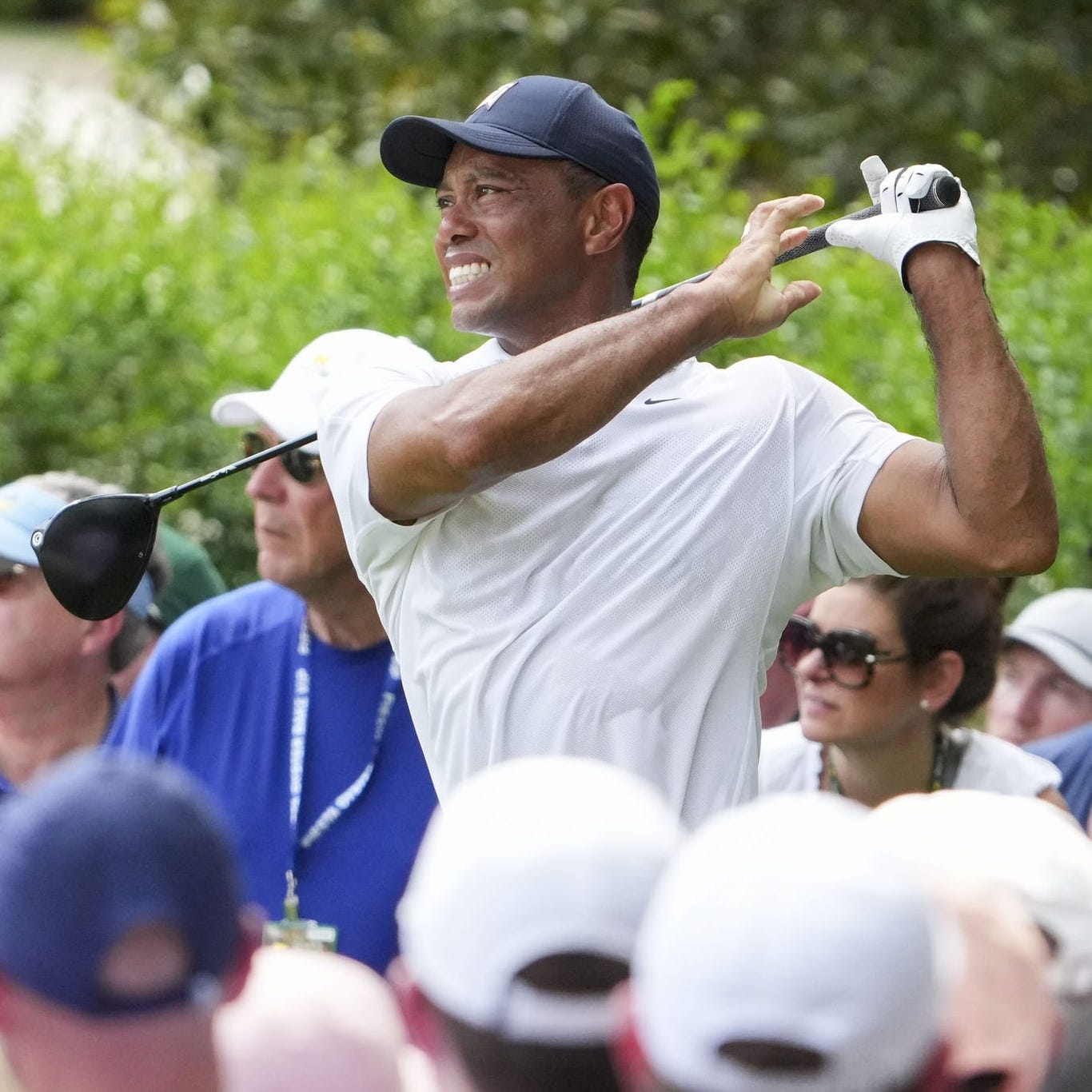 Tiger Woods tees off on the 14th hole during the first round of The Masters golf tournament.