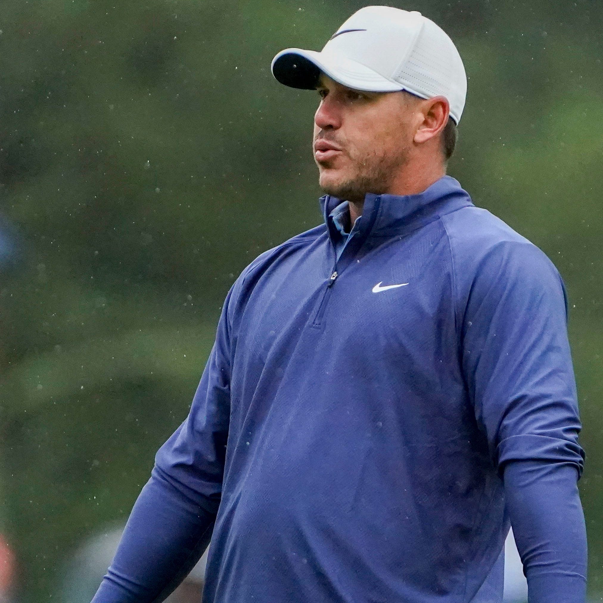 Brooks Koepka reacts after missing a putt on the third green in Saturday's third round of the Masters.