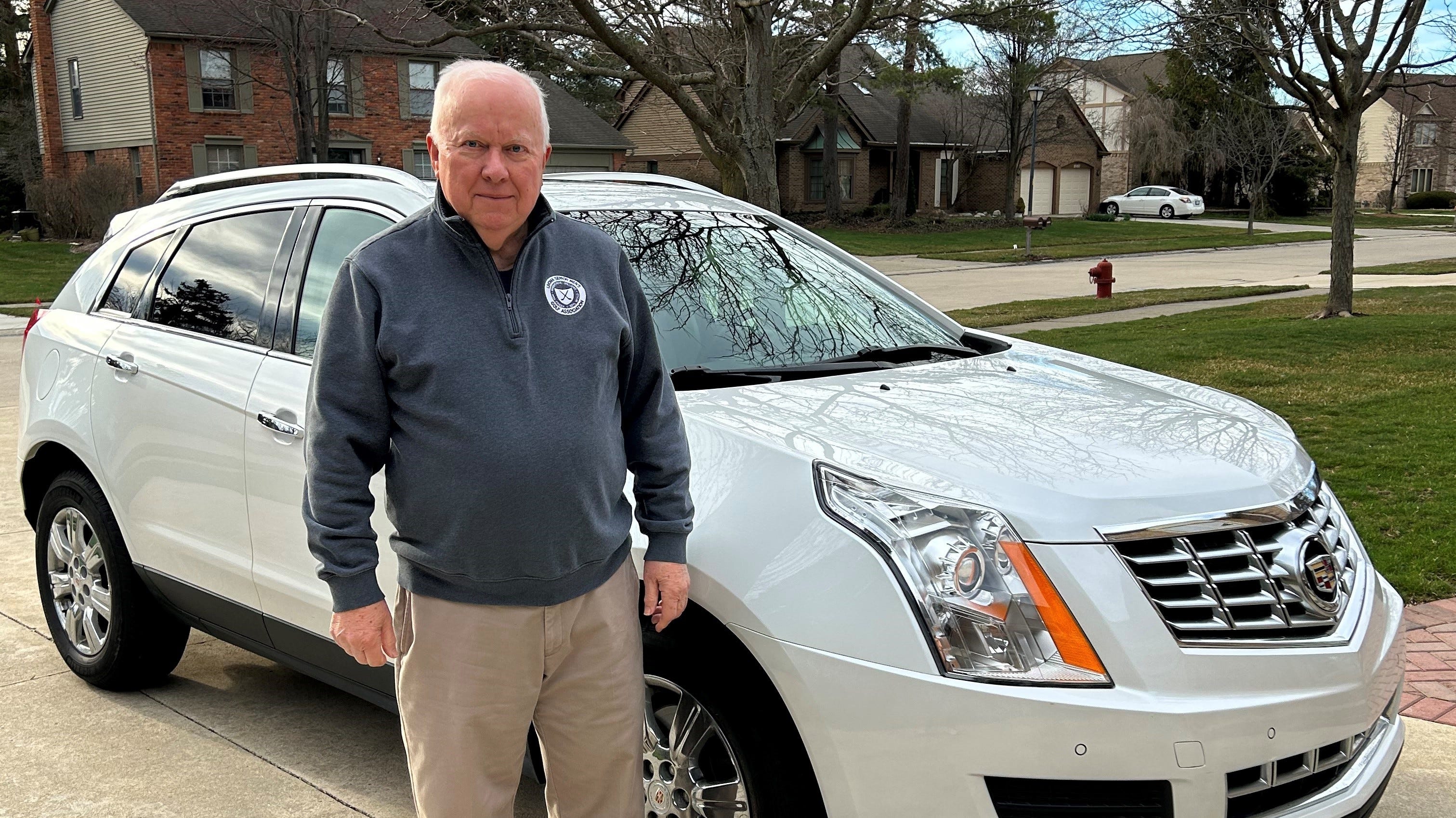 Will Lindley of Livonia was considering trading in his wife's 2016 Cadillac SRX (pictured here) for an electric vehicle, but he said it won't be a General Motors EV if it does not have Apple CarPlay.