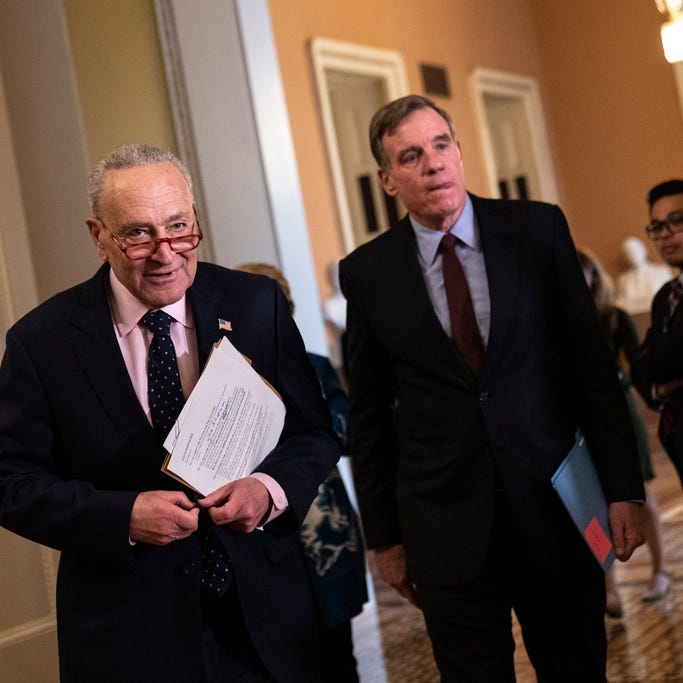 (L-R) Senate Majority Leader Chuck Schumer, D-N.Y., and Sen. Mark Warner, D-Va., arrive for a news conference following a closed-door lunch meeting with Senate Democrats at the U.S. Capitol March 22, 2023 in Washington, DC.