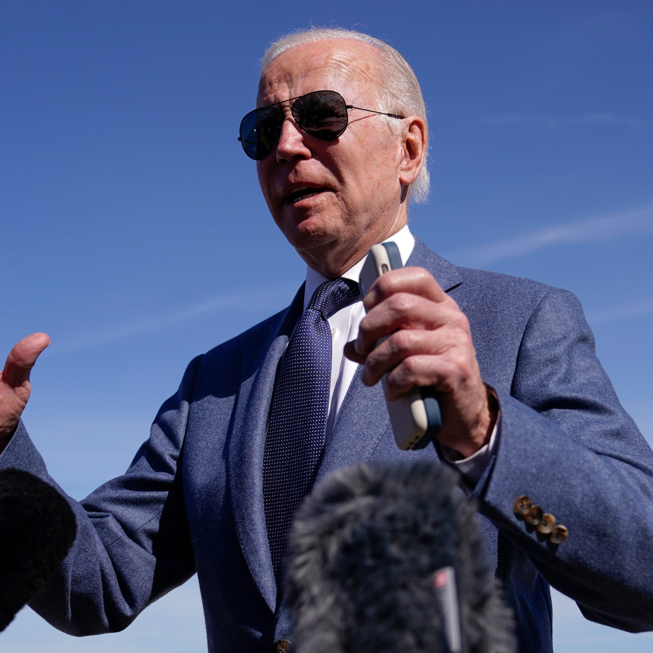 President Joe Biden talks with reporters before boarding Air Force One, Tuesday, April 11, 2023, at Andrews Air Force Base, Md. Biden is traveling the United Kingdom and Ireland in part to help celebrate the 25th anniversary of the Good Friday Agreement. (AP Photo/Patrick Semansky) ORG XMIT: MDPS303