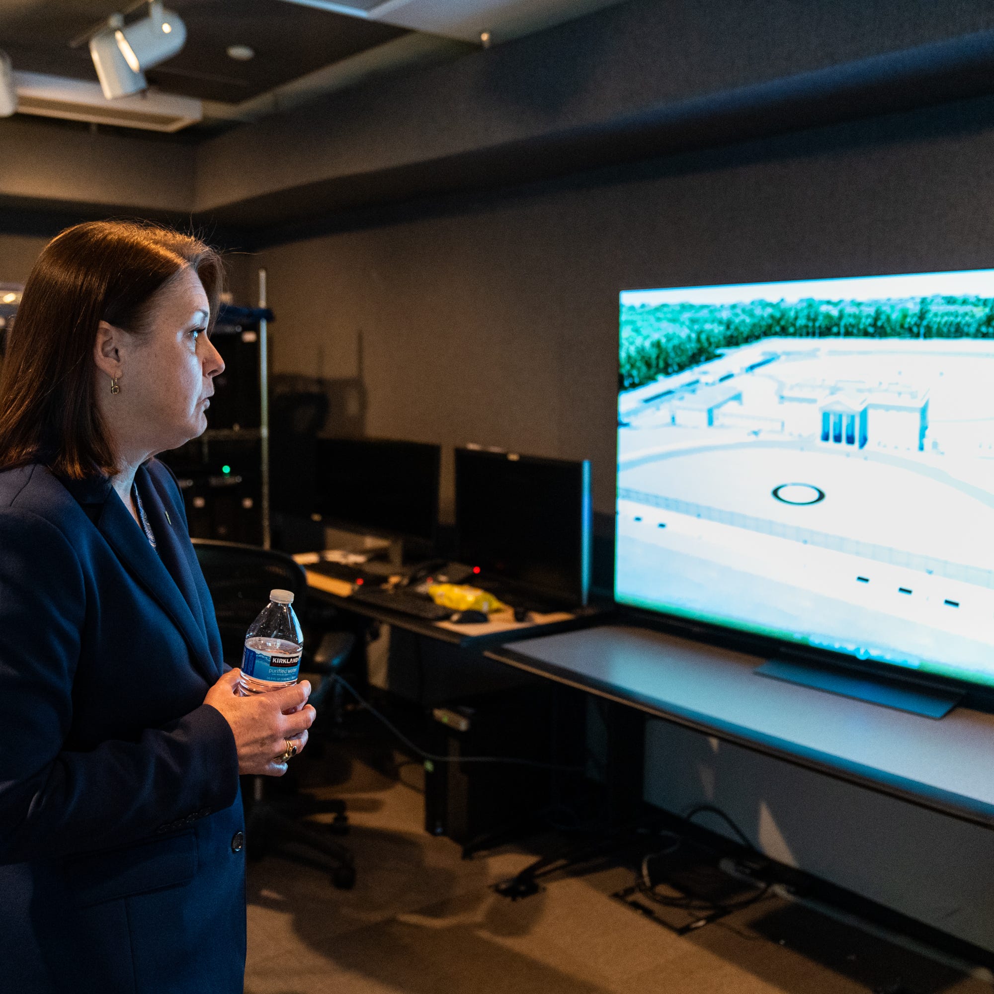 Kimberly Cheatle, the director of the Secret Service, shows a video of a proposed training facility that includes a full-scale replica of the White House inside a room in their headquarters in Washington, D.C.