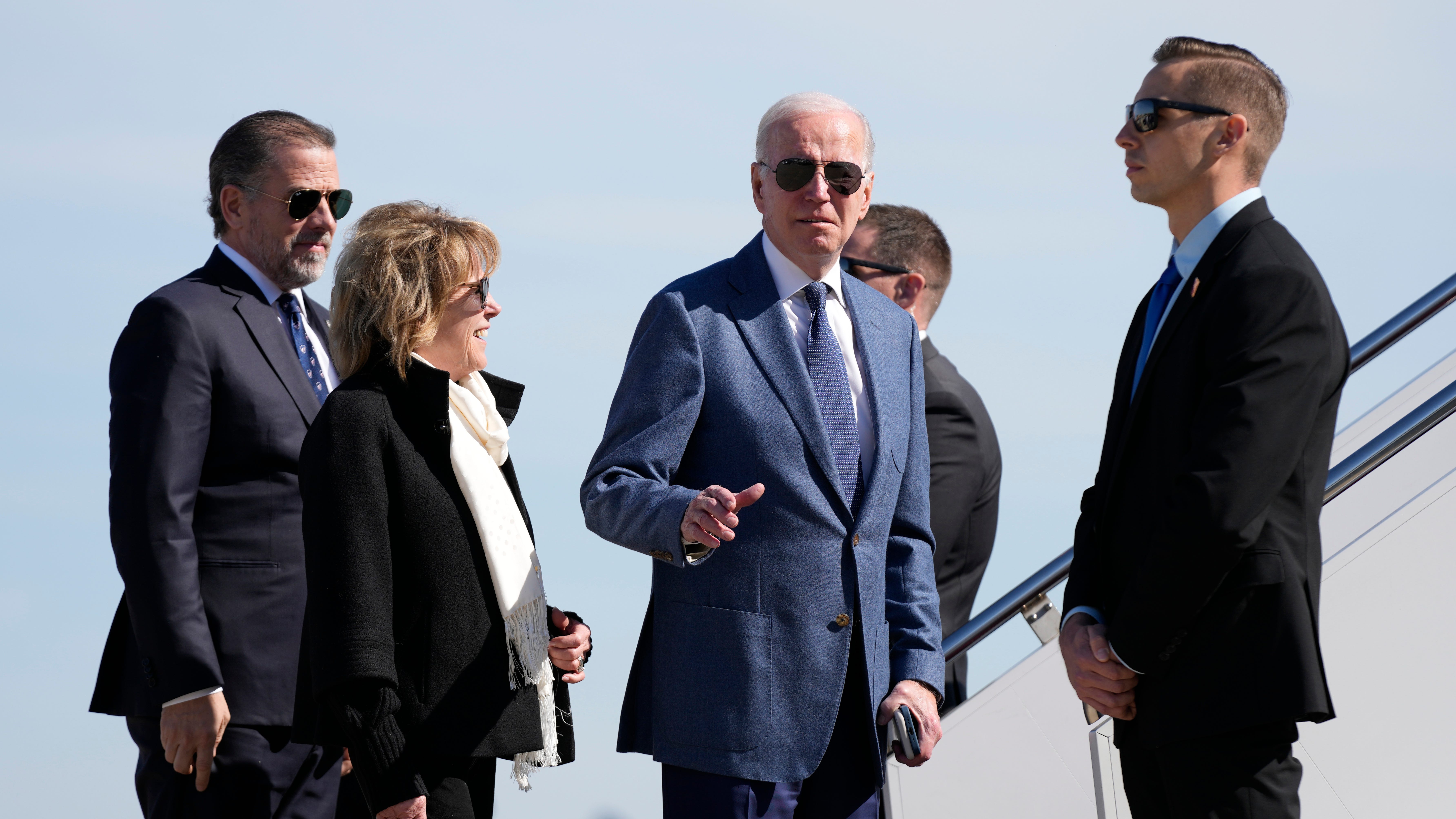 President Joe Biden gestures before he walked over to talk with reporters before boarding Air Force One, Tuesday, April 11, 2023, at Andrews Air Force Base, Md. Biden is traveling the United Kingdom and Ireland in part to help celebrate the 25th anniversary of the Good Friday Agreement. With Biden are his son Hunter Biden, left, and sister Valerie Biden(AP Photo/Patrick Semansky) ORG XMIT: MDPS308