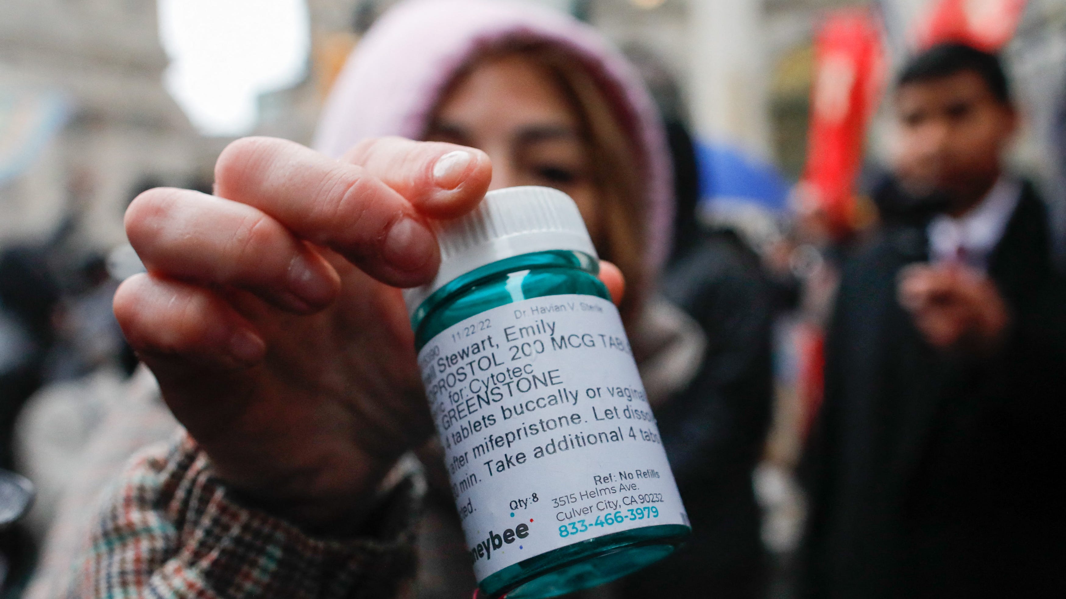 A pro-abortion activist displays abortion pills as she counter-protests during an anti-abortion demonstration on March 25, 2023 in New York City. (Photo by KENA BETANCUR / AFP) (Photo by KENA BETANCUR/AFP via Getty Images) ORIG FILE ID: AFP_33C29QV.jpg