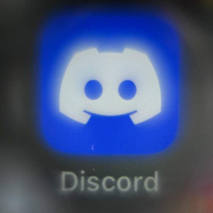 An illustration picture taken on March 2, 2023 in Moscow shows a smart phone screen bearing the Discord social network application logo.