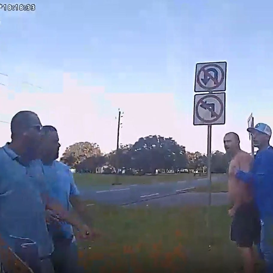 A screengrab from bodycam footage provided by the Nassau County (Fla.) Sheriff's Office shows two fathers engaged in a dispute after exchanging gunfire in a 2022 road rage incident. One of the men was charged.