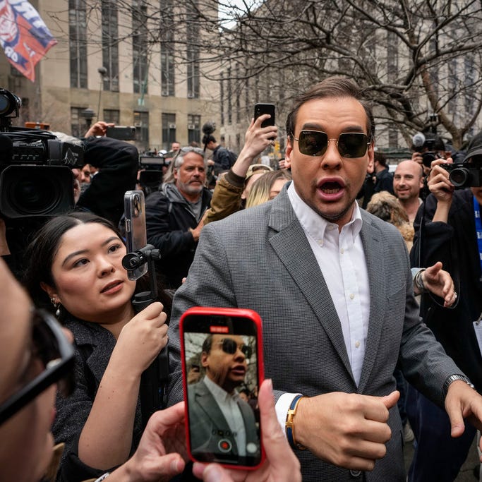 U.S. Rep. George Santos, R-N.Y., walks through the crowd gathered outside the courthouse where former U.S. President Donald Trump will arrive later in the day for his arraignment on April 4, 2023 in New York City.