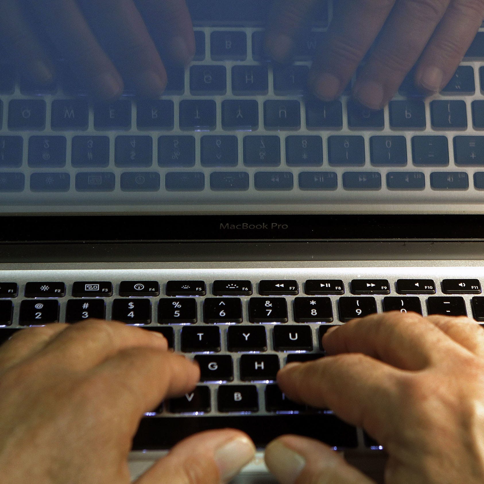 A person in Los Angeles types on a computer keyboard in this file photo illustration.