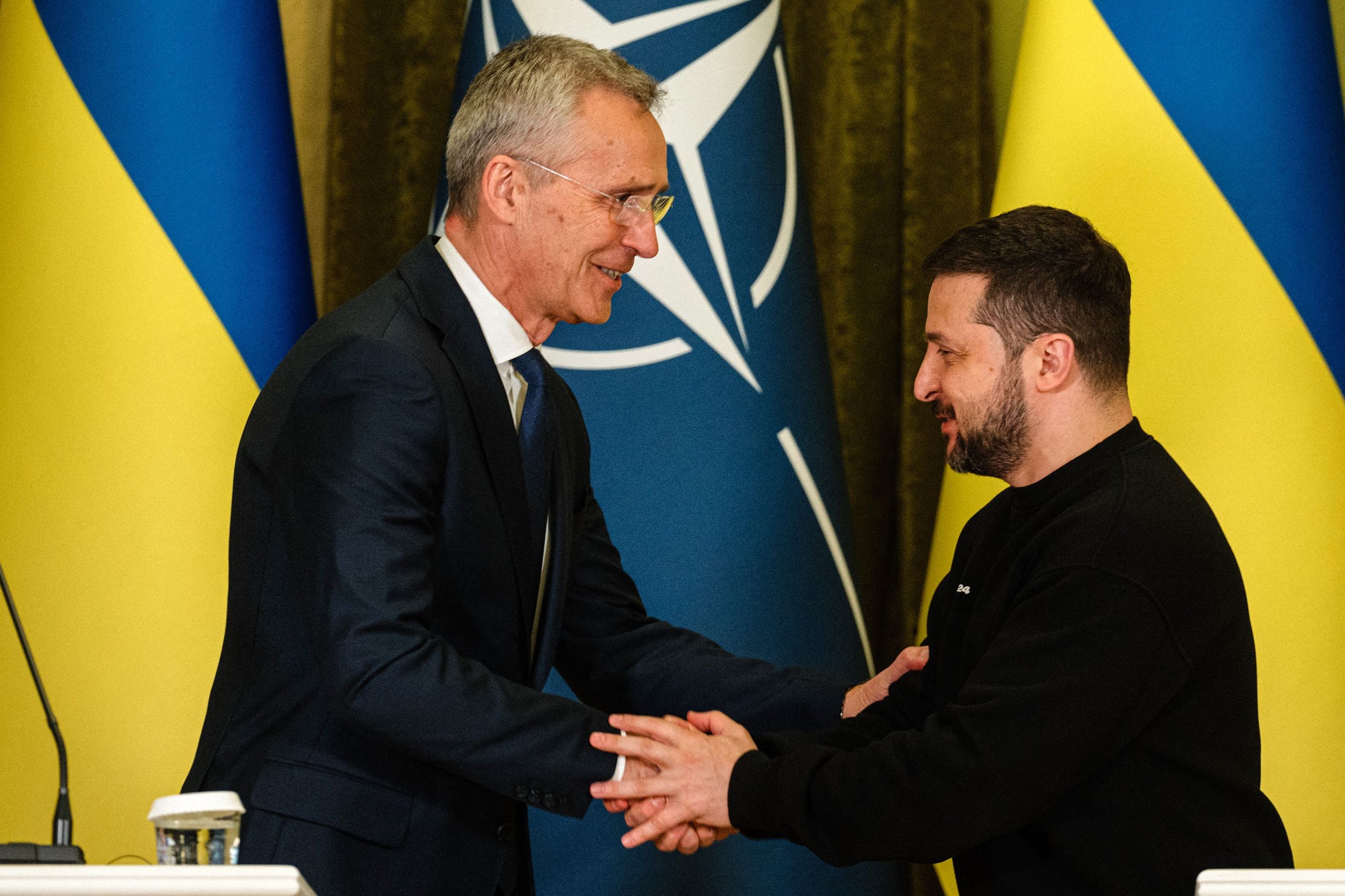 TOPSHOT - NATO head Jens Stoltenberg (L) shakes hands with Ukrainian President Volodymyr Zelensky at the end of a joint press conference in Kyiv, on April 20, 2023, amid the Russian invasion of Ukraine. - Stoltenberg on April 20, said the Western military alliance would "ensure that Ukraine prevails" against Russia but did not hold out any immediate prospect of alliance membership. (Photo by Dimitar DILKOFF / AFP) (Photo by DIMITAR DILKOFF/AFP via Getty Images) ORIG FILE ID: AFP_33DJ733.jpg