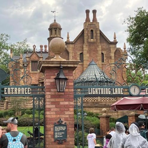 Guests line up for the Haunted Mansion at Disney World.