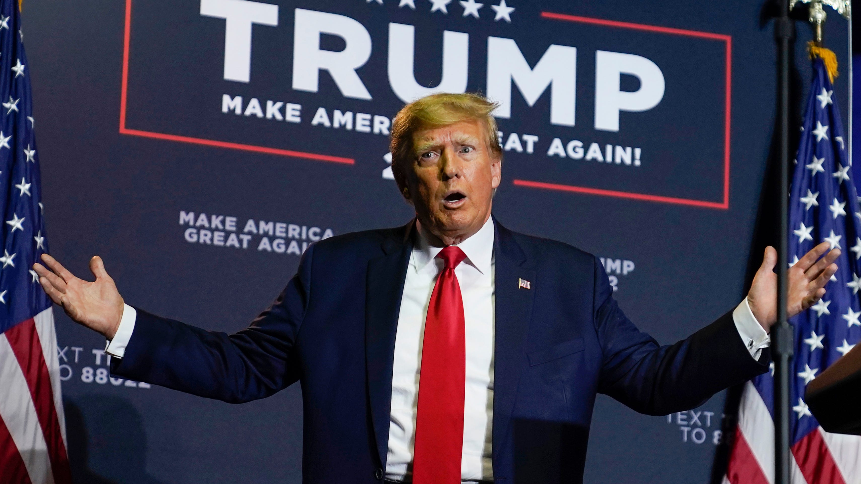 President Donald Trump reacts to the crowd as he arrives at a campaign rally, Thursday, April 27, 2023, in Manchester, N.H.