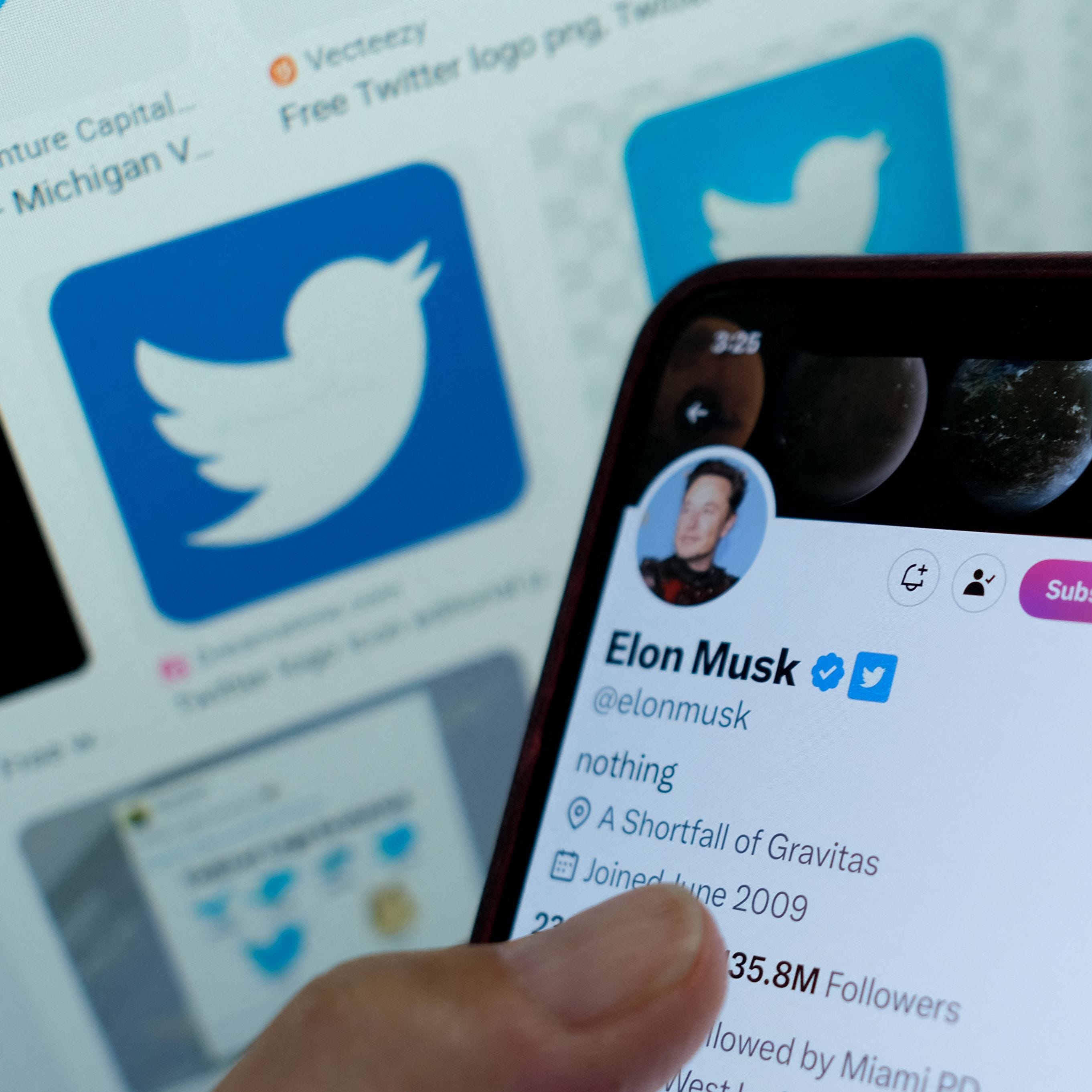 Elon Musk's blue checkmark next to his name on a smartphone.