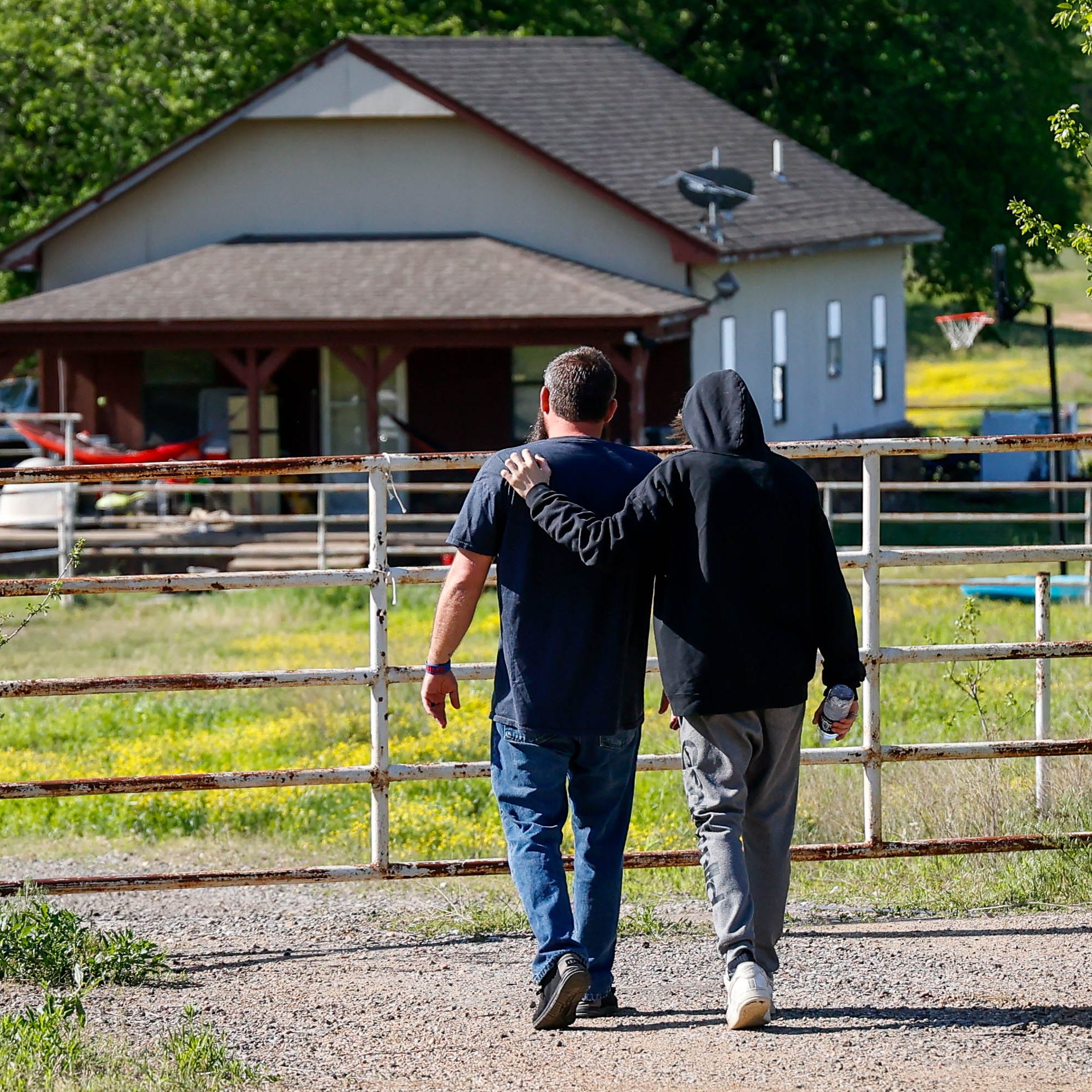 Justin and Haydon Webster, the father and brother of Ivy Webster who was found dead Monday, visit the site where Ivy's body was found in Henryetta Okla., on Tuesday, May 2, 2023.