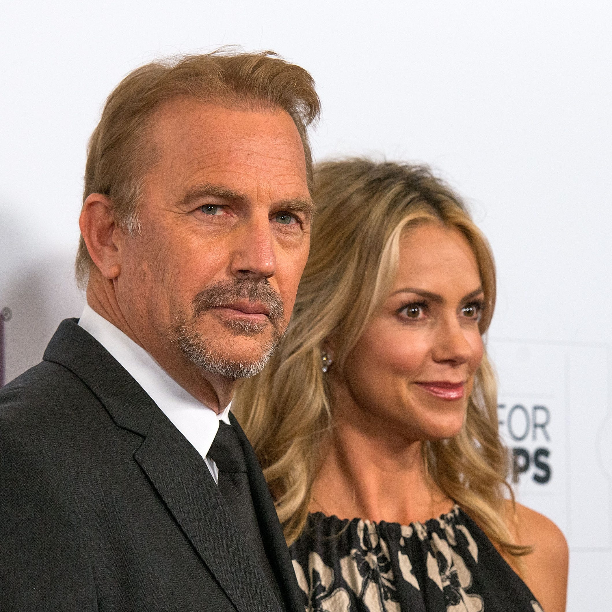 BEVERLY HILLS, CA - FEBRUARY 02:  Actor Kevin Costner and wife Christine Baumgartner arrive at the AARP The Magazine's 14th Annual Movies For Grownups Awards Gala at the Beverly Wilshire Four Seasons Hotel on February 2, 2015 in Beverly Hills, California.  (Photo by Valerie Macon/Getty Images) ORG XMIT: 532041041 ORIG FILE ID: 462685718