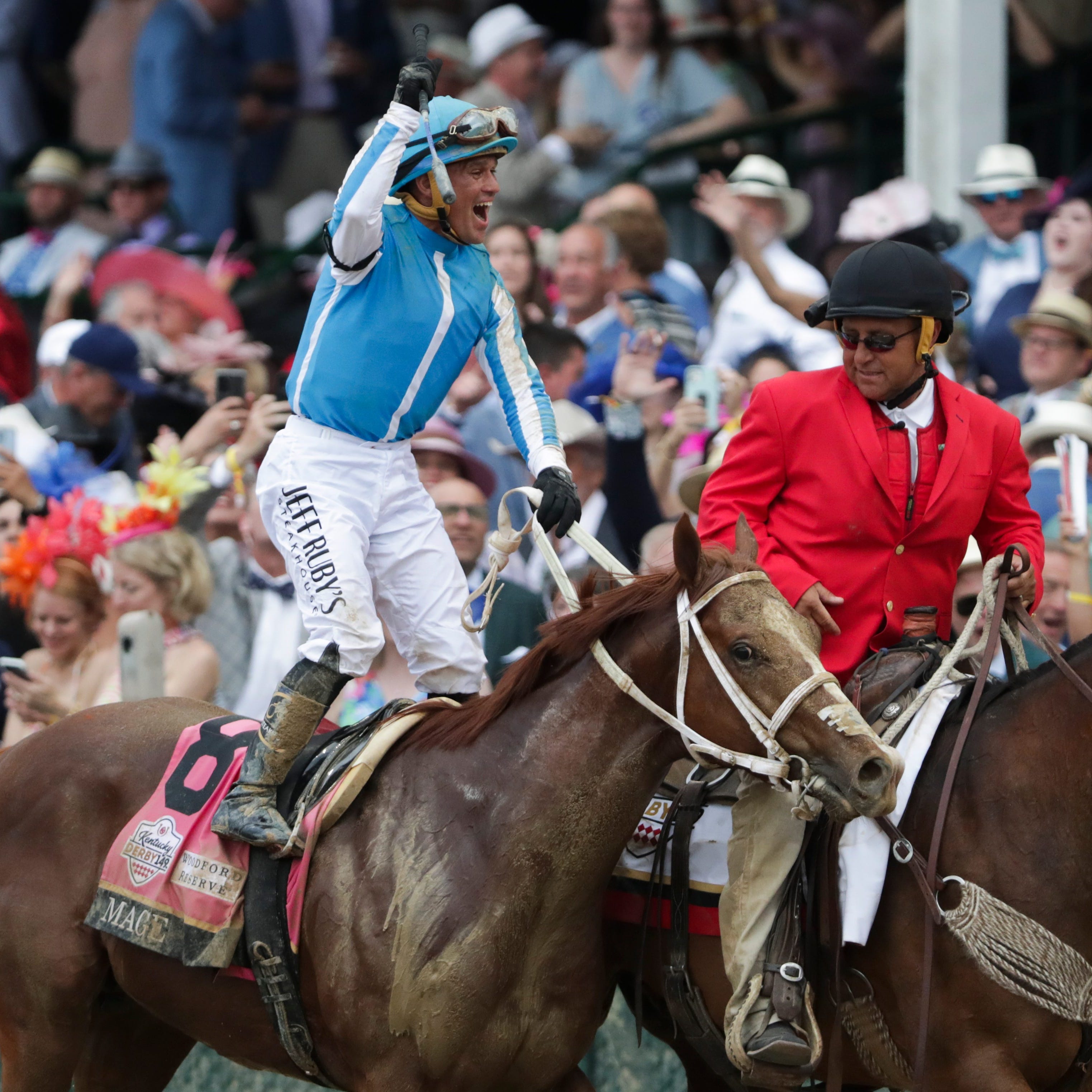 Jockey Javier Castellano celebrates after Mage won the Kentucky Derby.