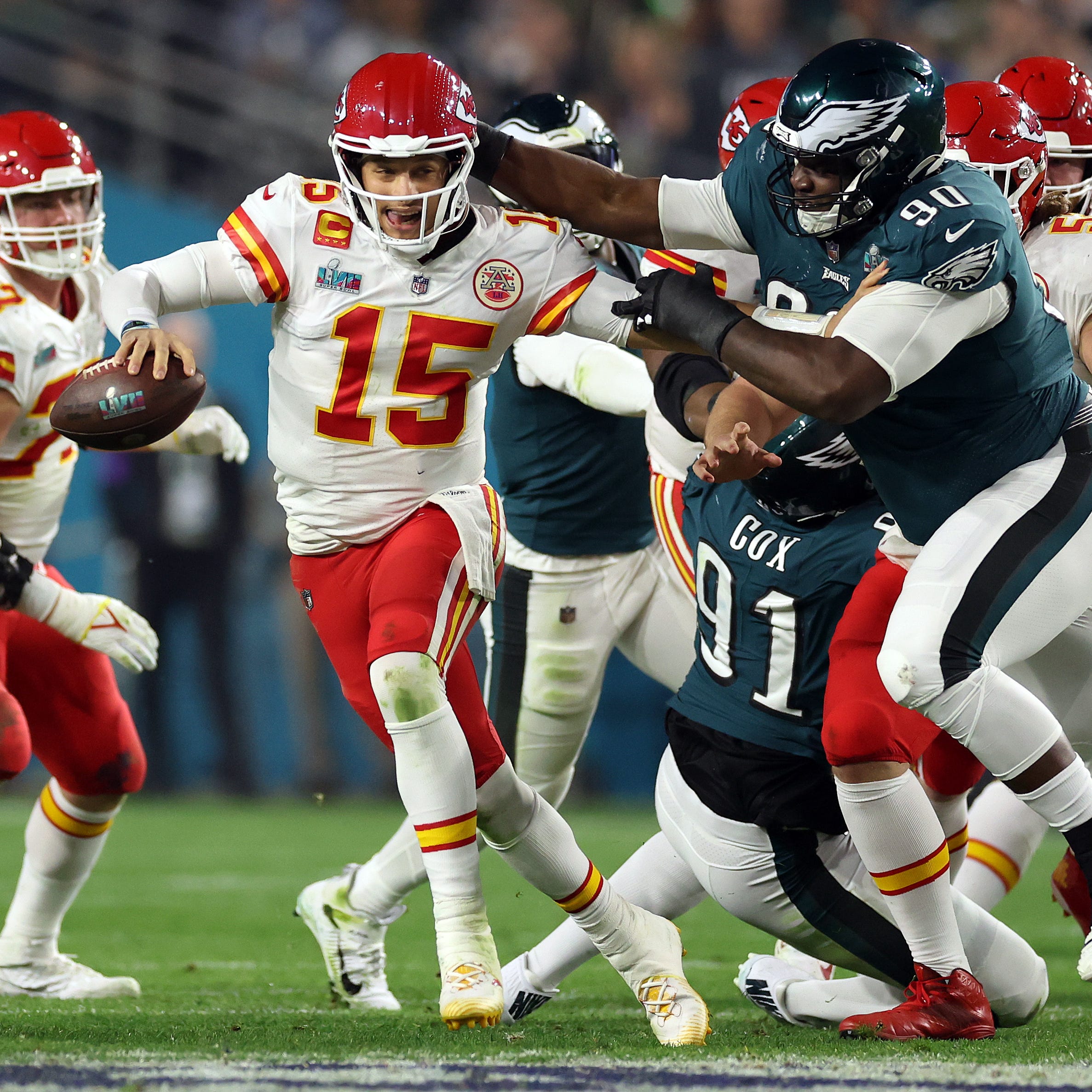 Patrick Mahomes #15 of the Kansas City Chiefs scrambles away from Jordan Davis #90 of the Philadelphia Eagles during the third quarter in Super Bowl LVII at State Farm Stadium on February 12, 2023 in Glendale, Arizona.