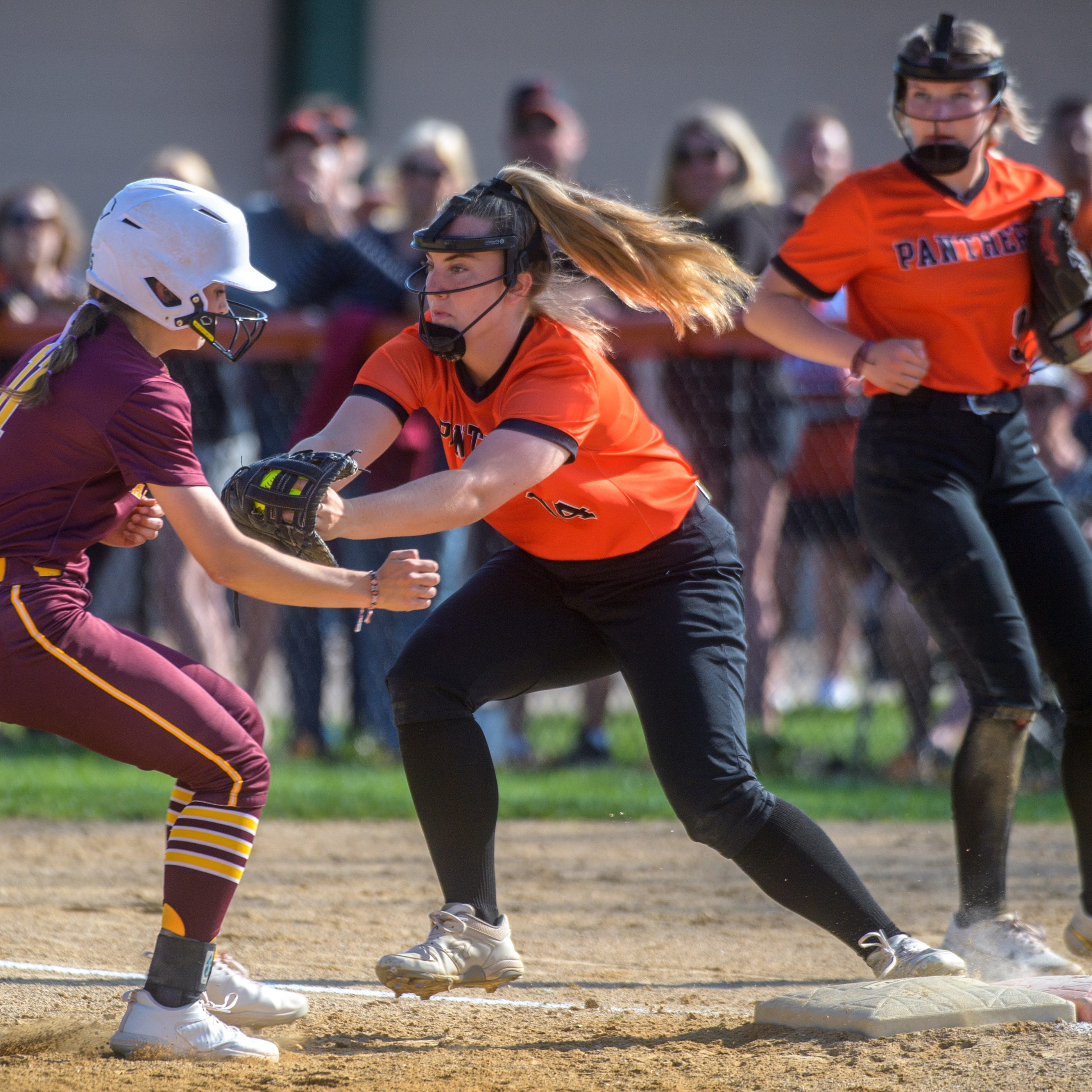 Washington's Carly Vaughn tags out East Peoria's Gabby Lane at first base Tuesday, May 9, 2023 at Jan Smith Field in Washington. The Panthers defeated the Raiders 2-1.