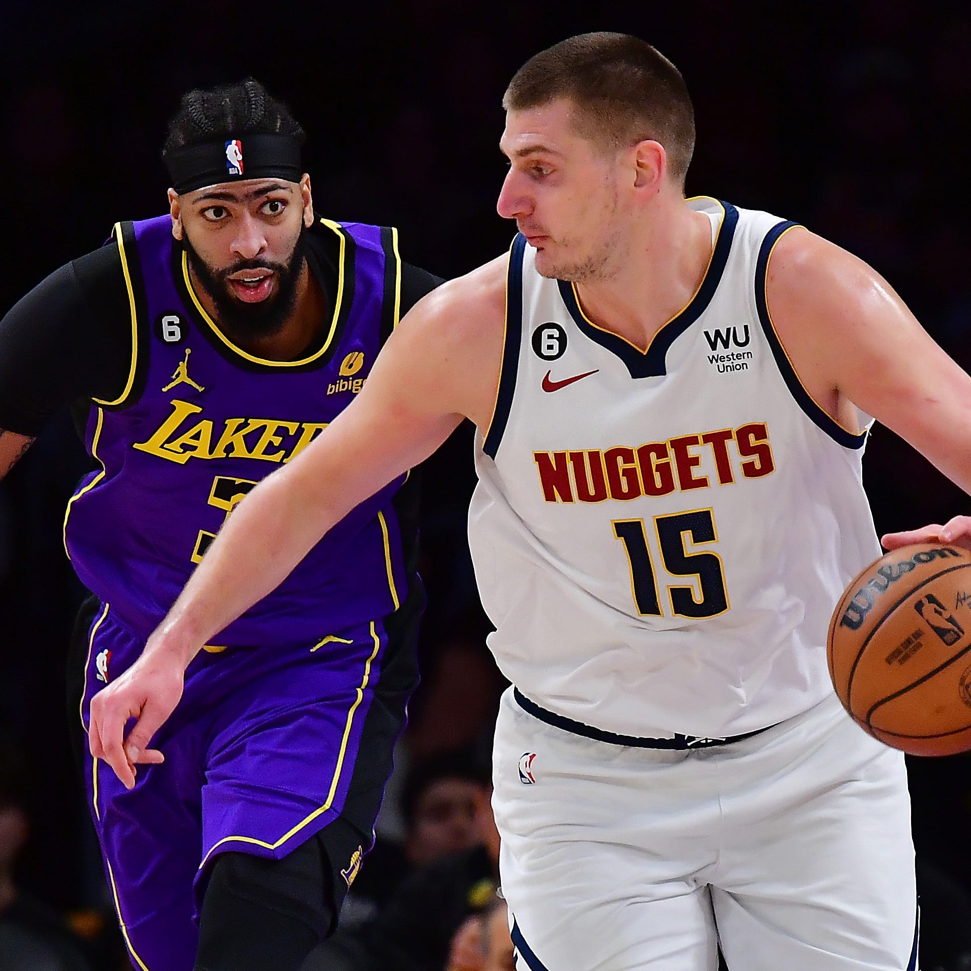 Nicola Jokic and Anthony Davis in action during a game in the regular season.