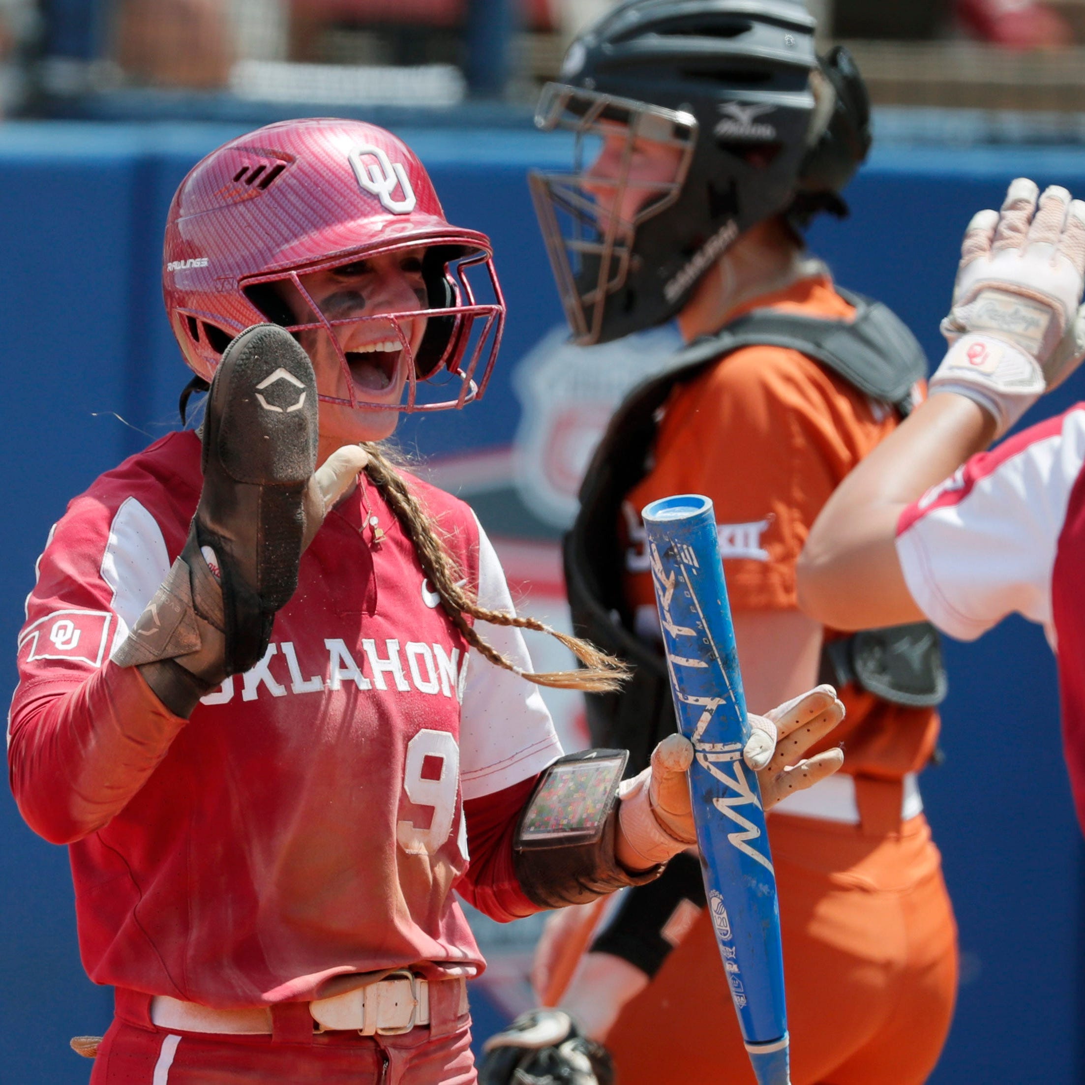 Oklahoma's Jordy Bahl (98) celebrates after scoring a run during the Big 12 softball tournament championship game against Texas.