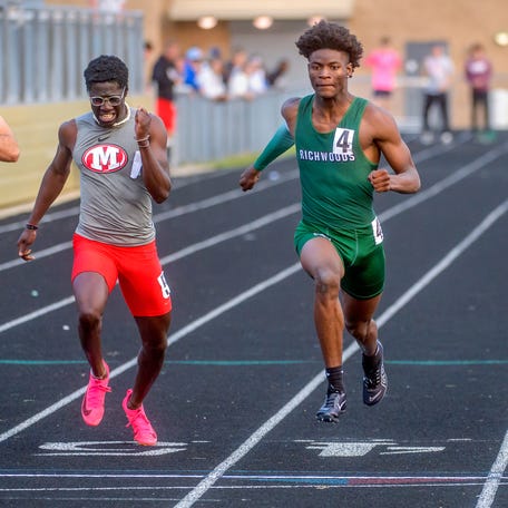 Richwoods' Darrin Dussett, middle, beats Morton's Nyamedze Maison, left, and Fairbury Prairie Central's Hudson Ault to the finish line in the 100-meter dash Wednesday, May 17, 2023 during the Class 2A Dunlap Track and Field Sectional at Dunlap High School. Dussett won the event with Maison finishing third and Ault fourth.
