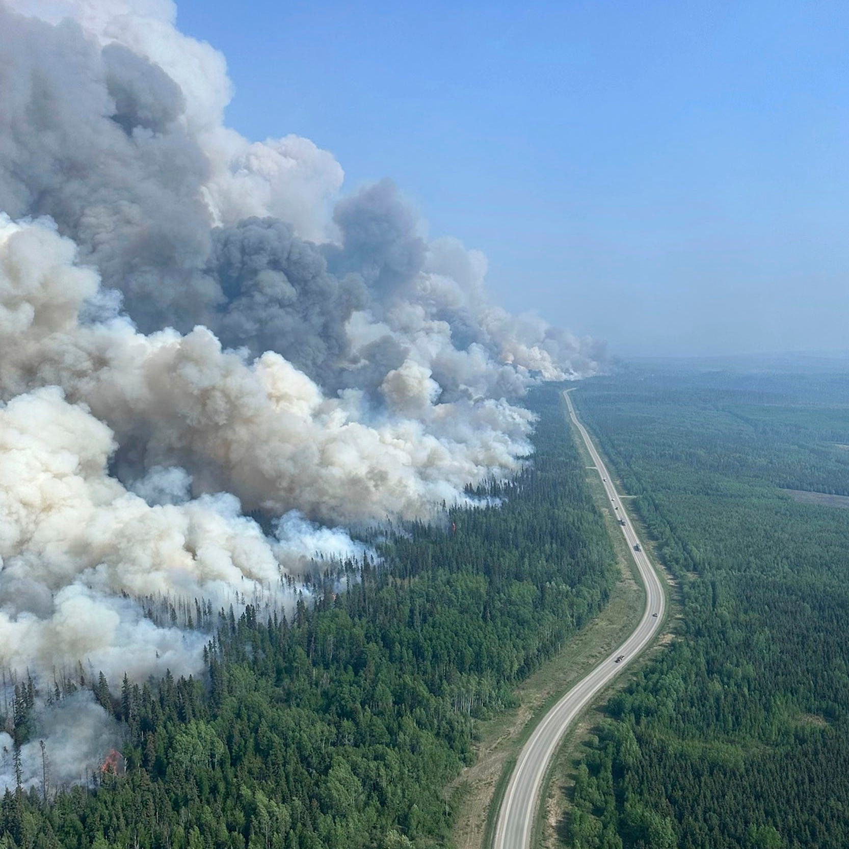 In this photo released by the British Columbia Wildfire Service, a 2,000 hectares planned ignition is successfully completed on the Stoddart Creek wildfire, on Saturday, May 20, 2023, in Stoddart Creek, British Columbia. The operation achieved its objective of removing unburnt, highly susceptible understory fuels and timber between the fire's westernmost edge and Highway 97 and has reduced the likelihood of further spread west across the highway.