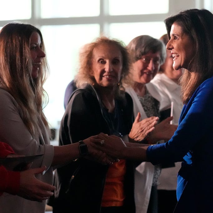 Republican presidential candidate Nikki Haley shakes hands with guests during a campaign gathering, Wednesday, May 24, 2023, in Bedford, N.H.