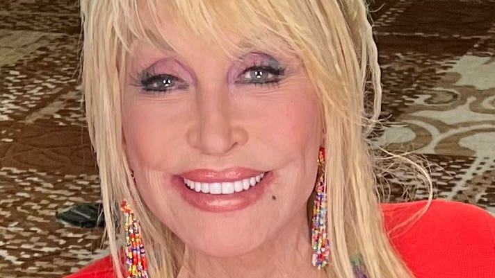 Dolly Parton's bright smile lights up even further when talking about her community.