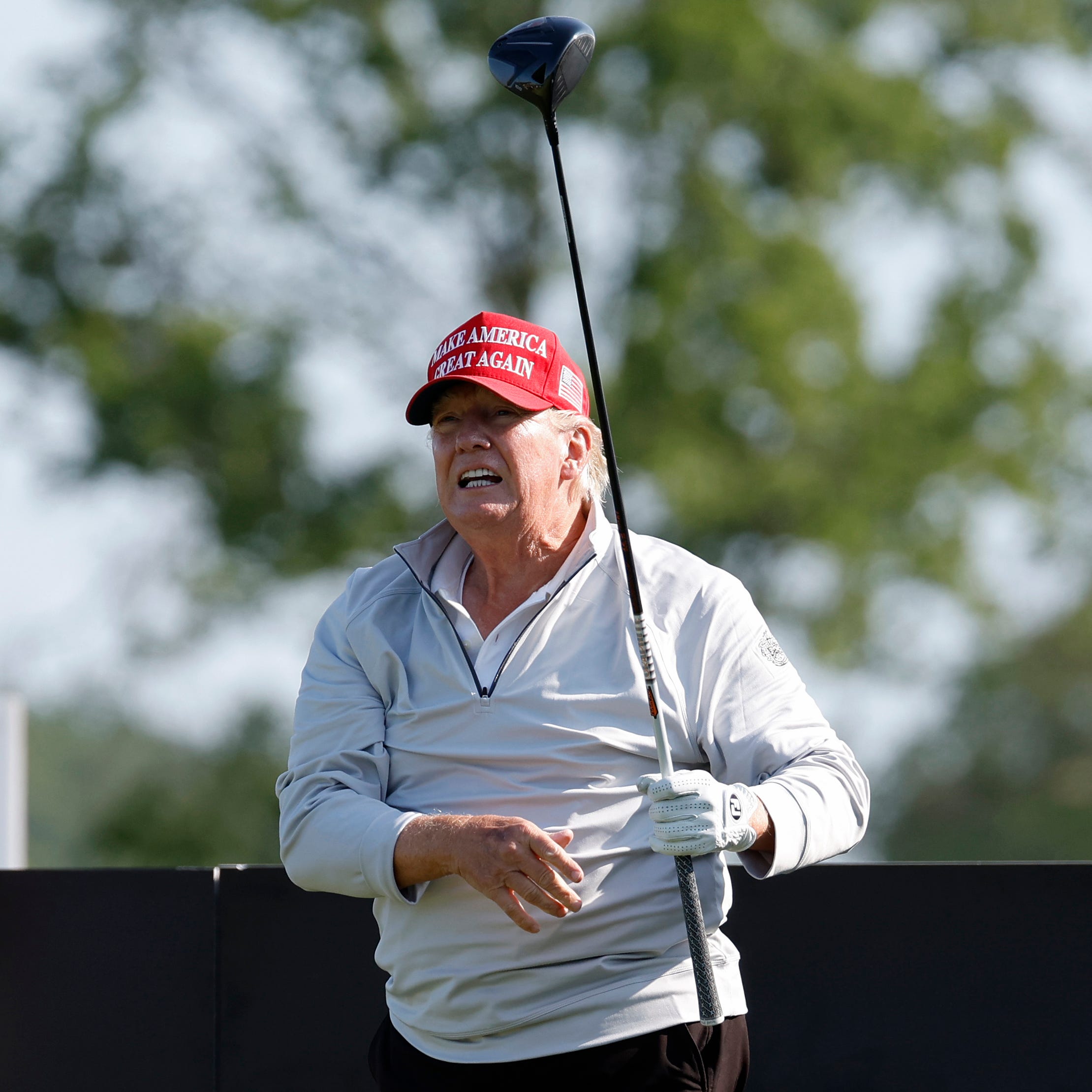 May 25, 2023; Washington, DC, USA; Former President Donald Trump hits his tee shot on the first hole during the Pro-Am tournament as part of the LIV Golf Washington D.C. 2023 event at Trump National Golf Club outside Washington DC. on May 25, 2023.