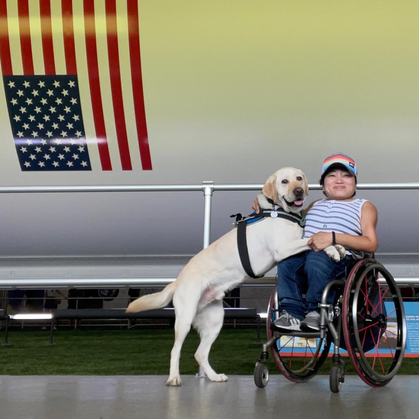 Mia Ives-Rublee and her service dog Zini.