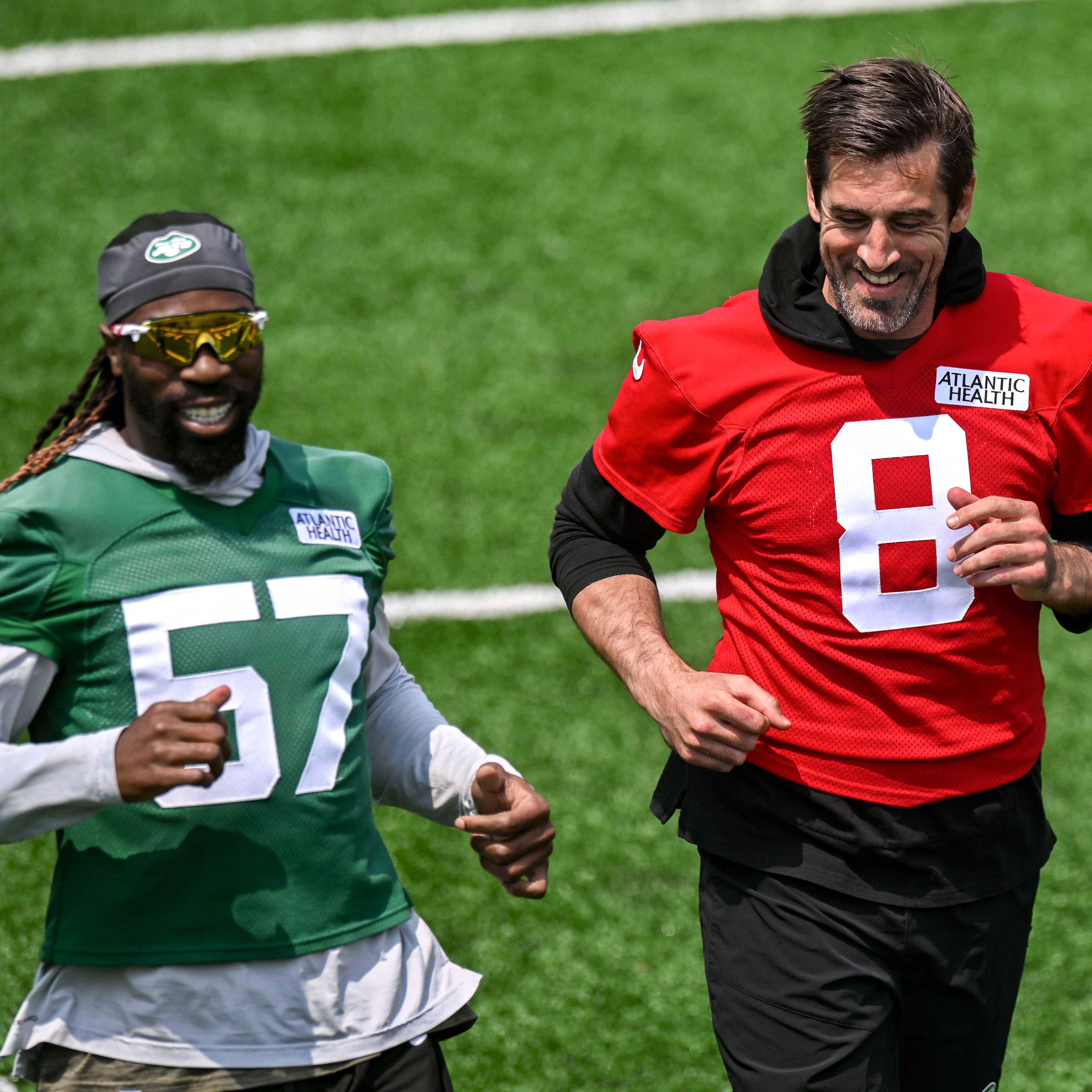 New York Jets quarterback Aaron Rodgers (8) warms up during OTA's at Atlantic Health Jets Training Center.