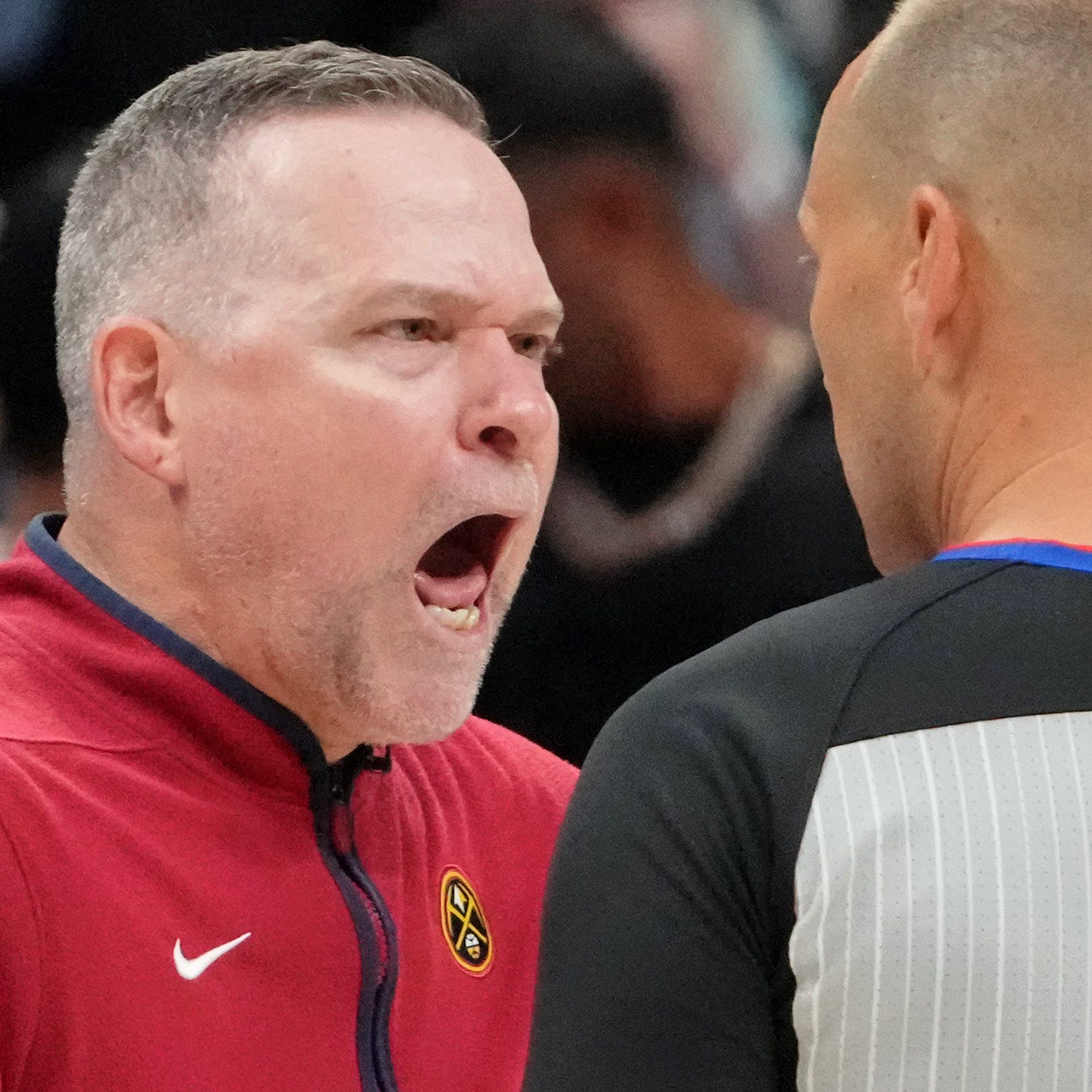 Michael Malone argues with referee John Goble during Game 2 of the NBA Finals.