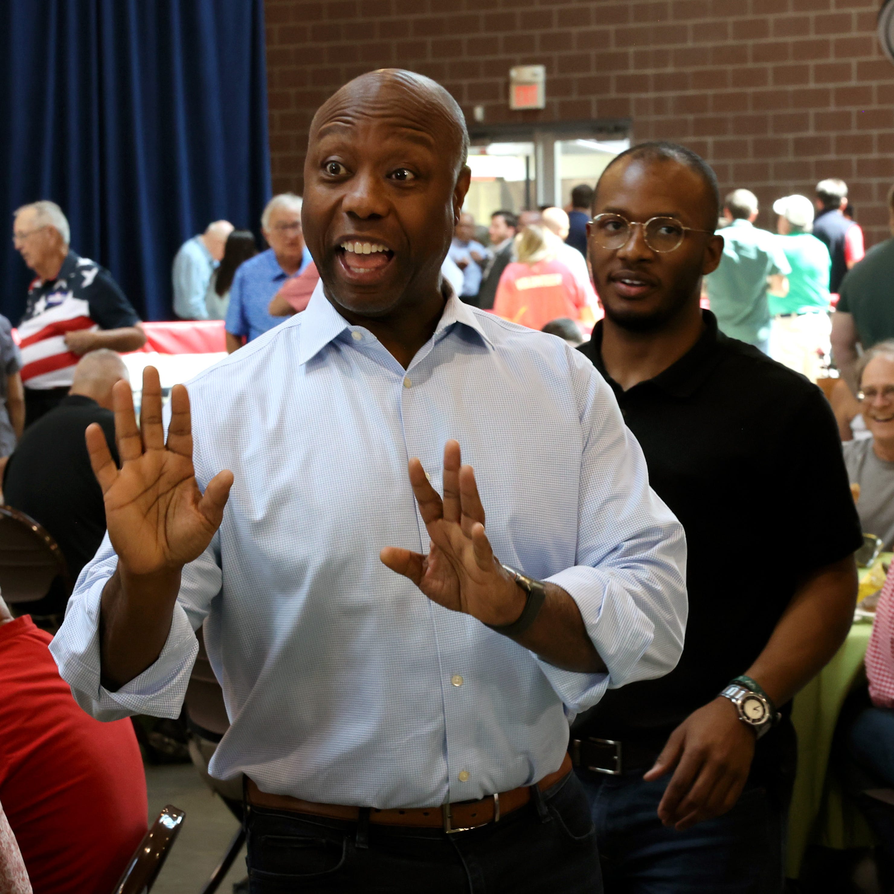 DES MOINES, IOWA - JUNE 03: Republican presidential candidate Senator Tim Scott (R-SC) greets guests during the Joni Ernst's Roast and Ride event on June 03, 2023 in Des Moines, Iowa. The annual event helps to raise money for veteran charities and highlight Republican candidates and platforms. (Photo by Scott Olson/Getty Images) ORG XMIT: 775985049 ORIG FILE ID: 1495687317