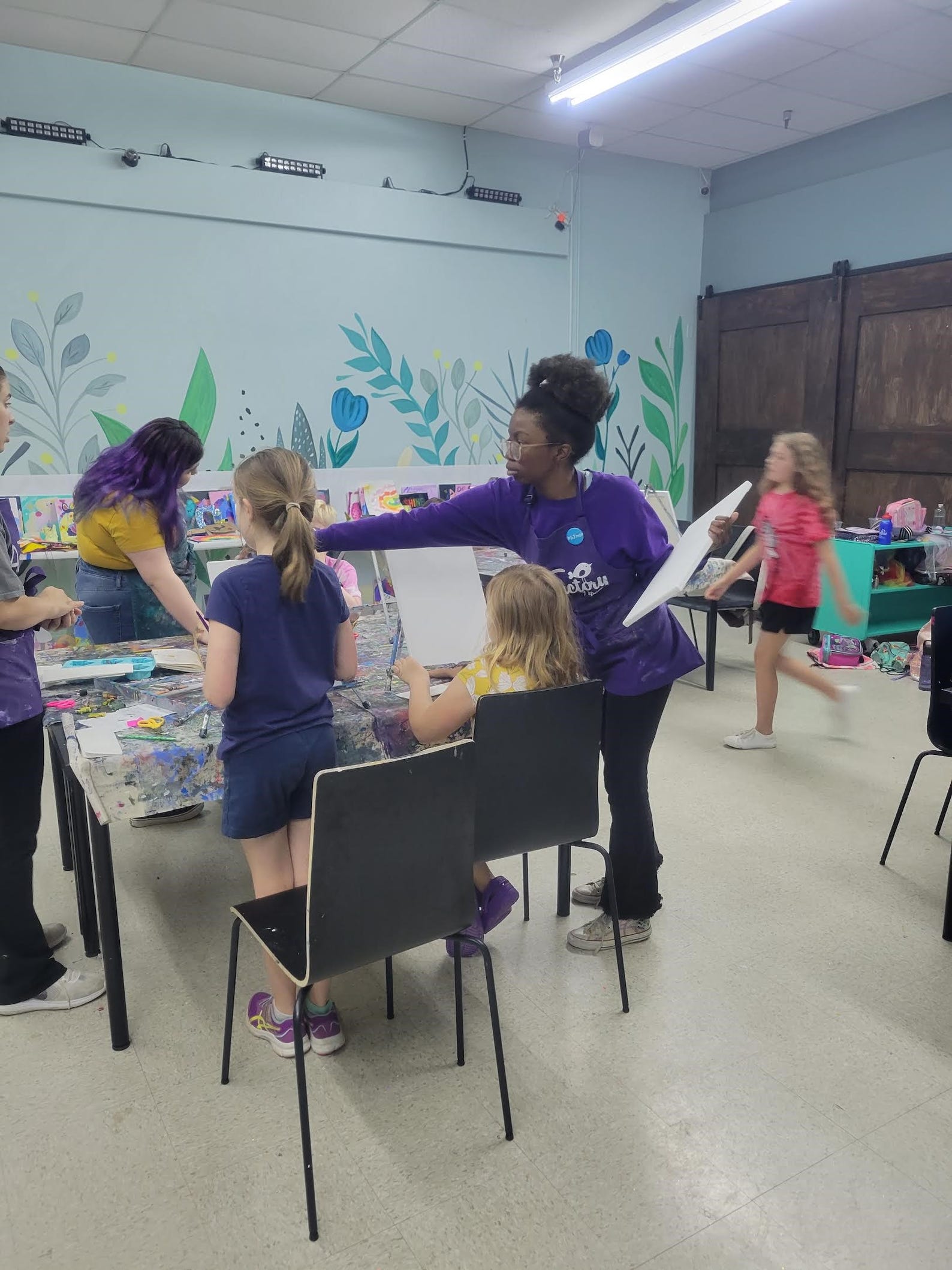 McKenzie Ewing, 17, helps kids at the Art Factory's summer camp