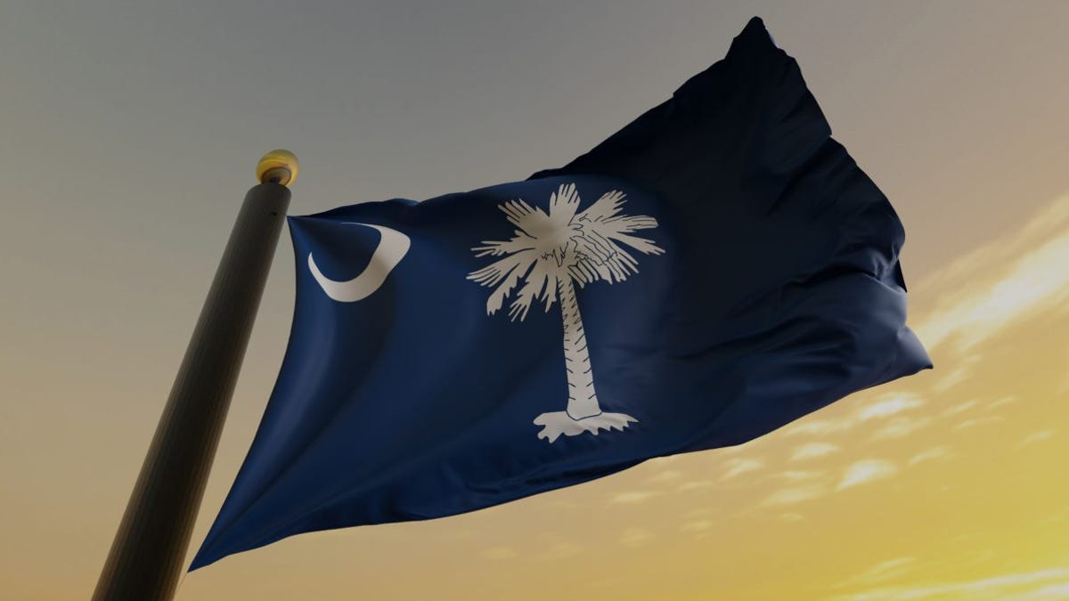 Why are flags flying at half-staff in South Carolina?