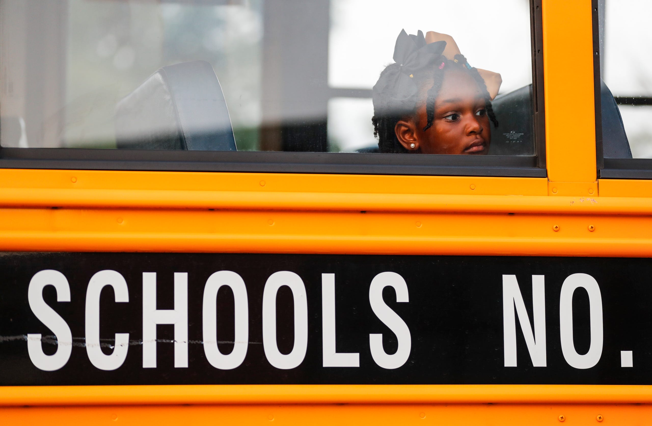 A student waits to disembark from a school bus outside Shaffner Elementary in Shively on Wednesday morning. Aug. 9, 2023.