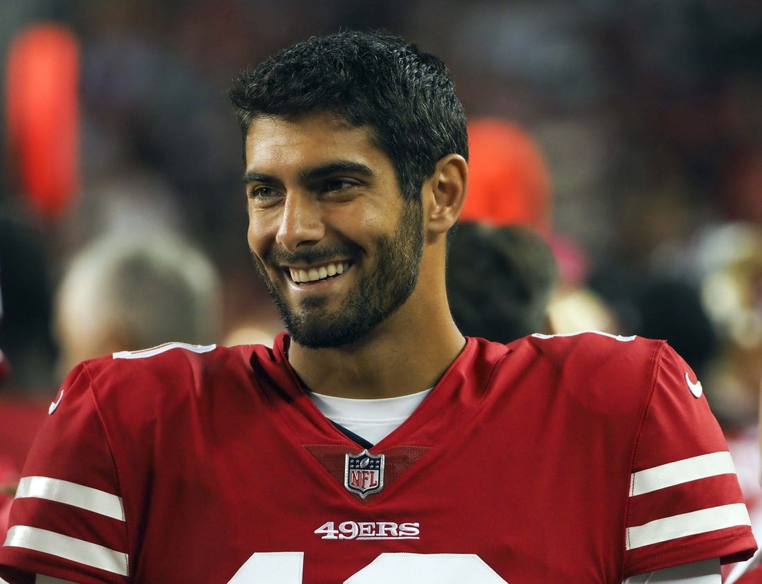 San Francisco 49ers quarterback Jimmy Garoppolo smiles on the sideline during the third quarter against the Dallas Cowboys at Levi's Stadium on Thursday.