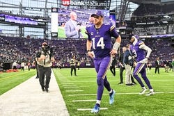 Minnesota Vikings quarterback Sam Darnold (14) runs off the field after the game against the Atlanta Falcons at U.S. Bank Stadium. Mandatory Credit: Jeffrey Becker-Imagn Images